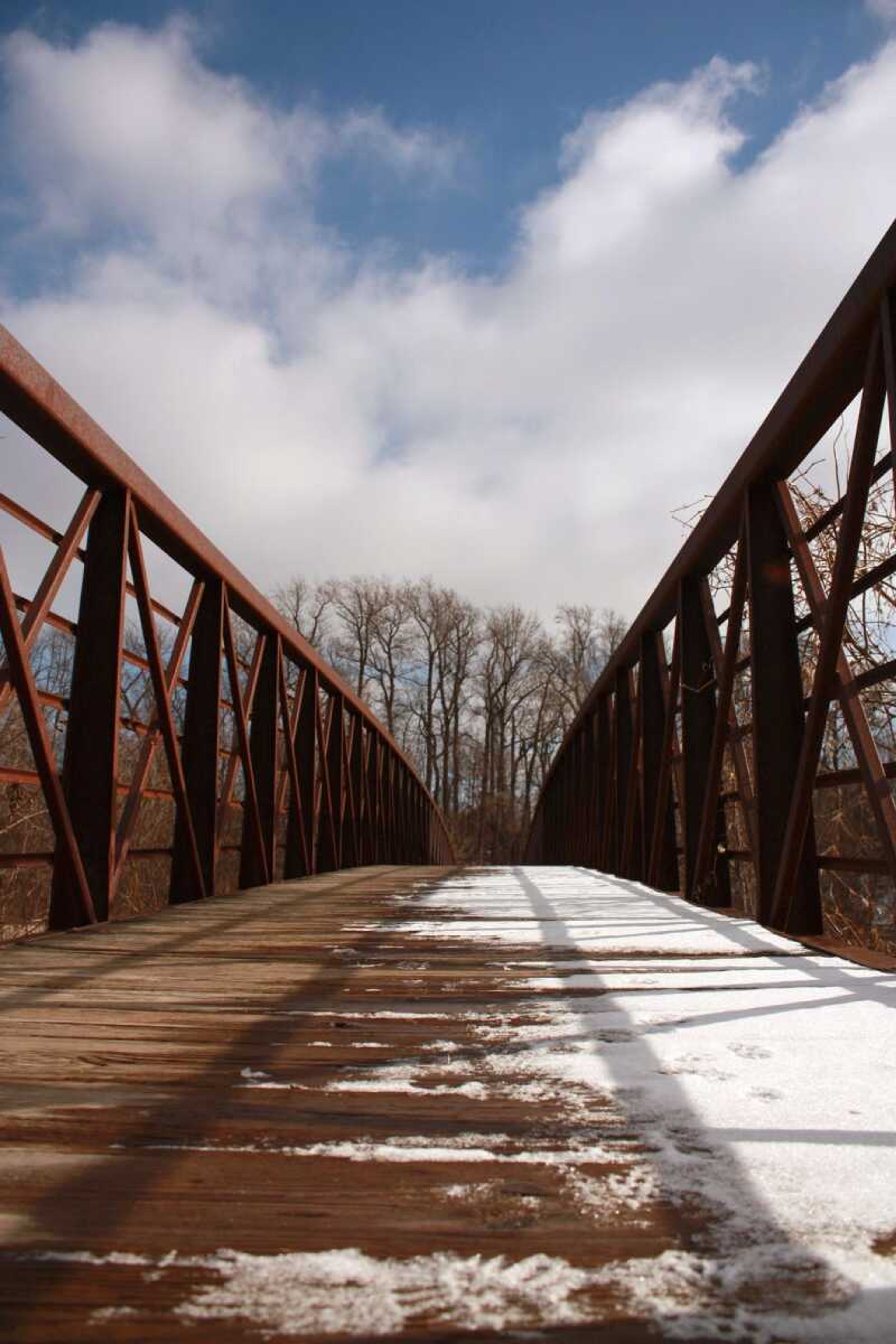 This pedestrian bridge leads to a soccer field at Shawnee Park where the city's walking trail ends. The city plans to extend the trail to West End Boulevard. (BOB MILLER)