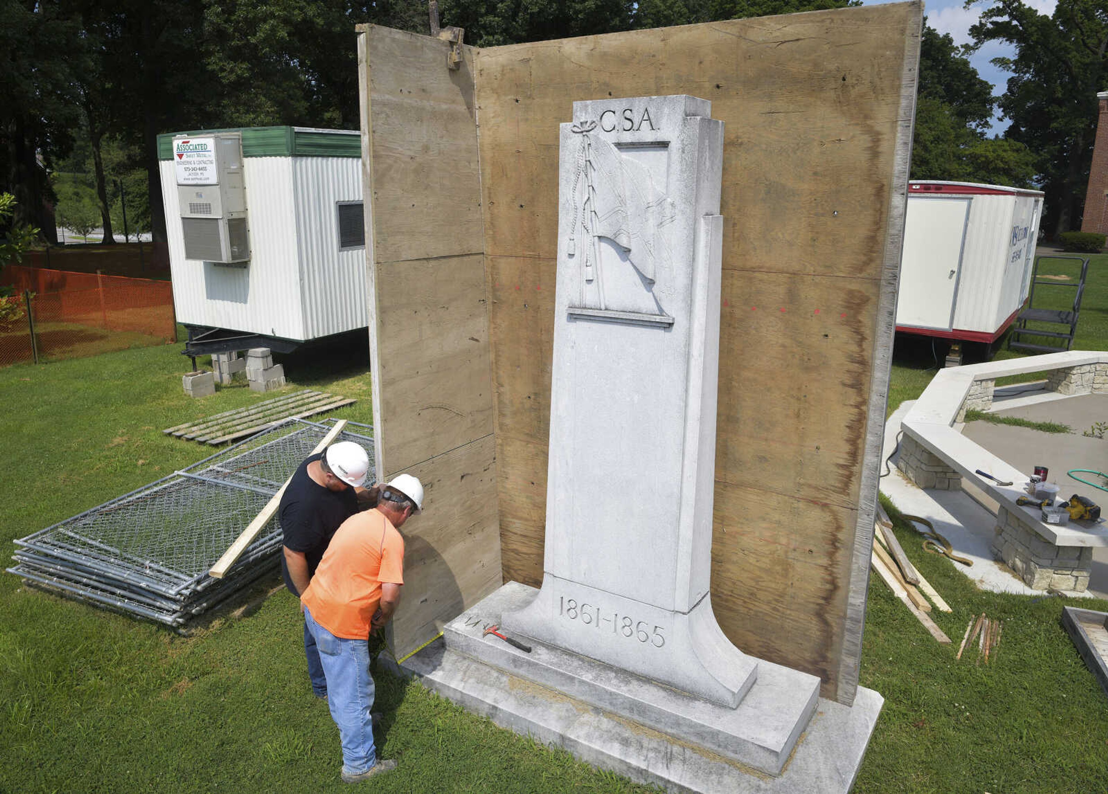 Construction workers measure the base of a Confederate States of America monument in Ivers Square on Tuesday, July 7, 2020, in Cape Girardeau.