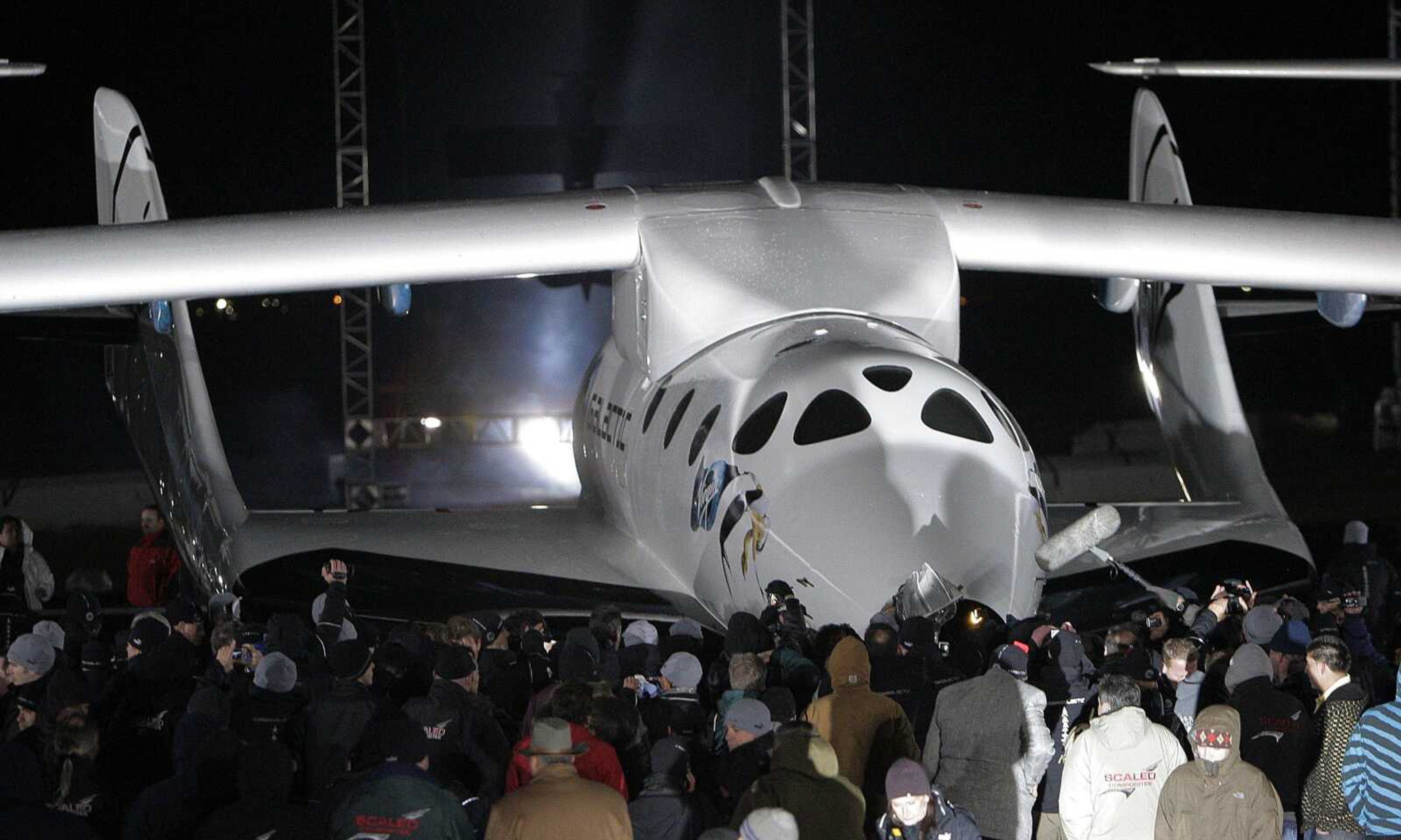 SpaceShipTwo, a spacecraft designed to rocket wealthy tourists into space as early as 2011, is unveiled Monday in Mojave, Calif. The long-awaited glimpse of SpaceShipTwo marks the first public appearance of a commercial passenger spacecraft. (JAE C. HONG ~ Associated Press)