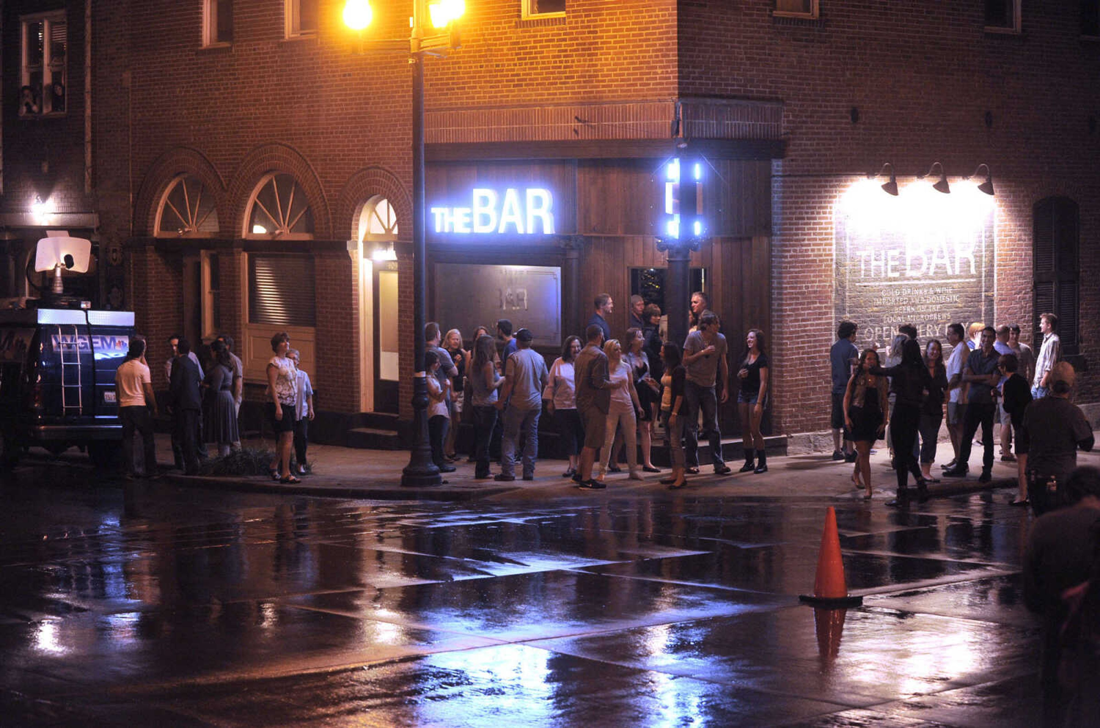 FRED LYNCH ~ flynch@semissourian.com
Extras for "Gone Girl" rehearse a scene outside The Bar Friday, Sept. 27, 2013 in downtown Cape Girardeau.