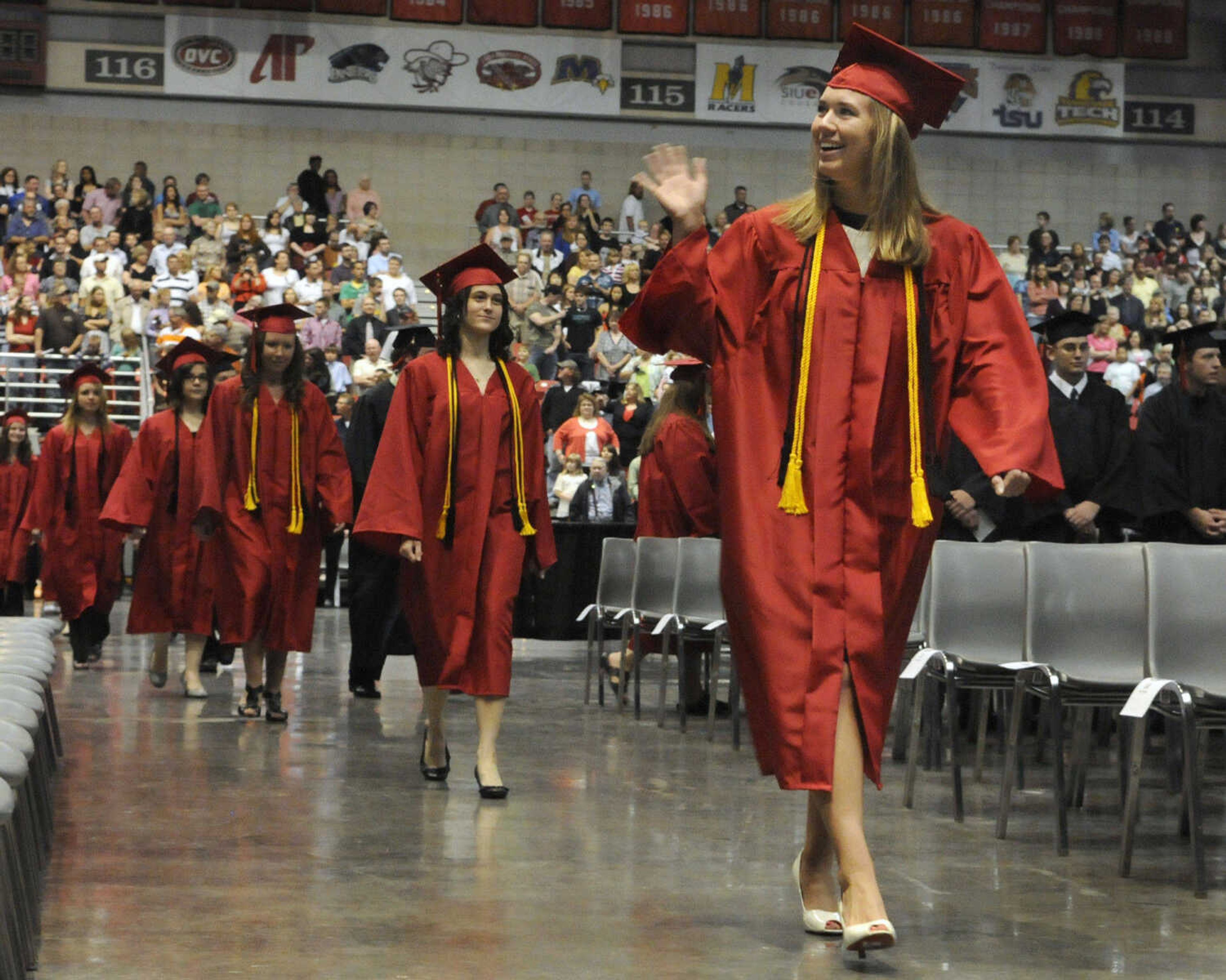 KRISTIN EBERTS ~ keberts@semissourian.com

Rachael Meyr waves to family and friends during the processional march at Jackson High School's commencement ceremony at the Show Me Center in Cape Girardeau, Mo., on Thursday, May 20, 2010.