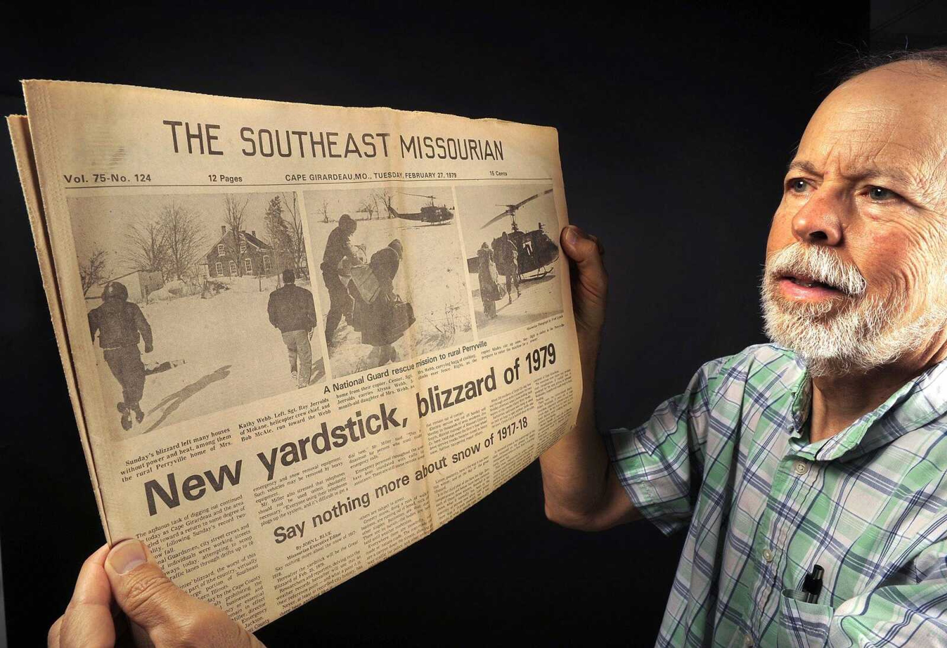 Fred Lynch shows the Feb. 27, 1979 edition of the Southeast Missourian with its coverage of the Blizzard of 1979. His photographs show a National Guard helicopter crew rescuing Kathy Webb and her 3-month-old daughter, Alyssa, from their rural Perryville, Missouri home that had no power or heat.