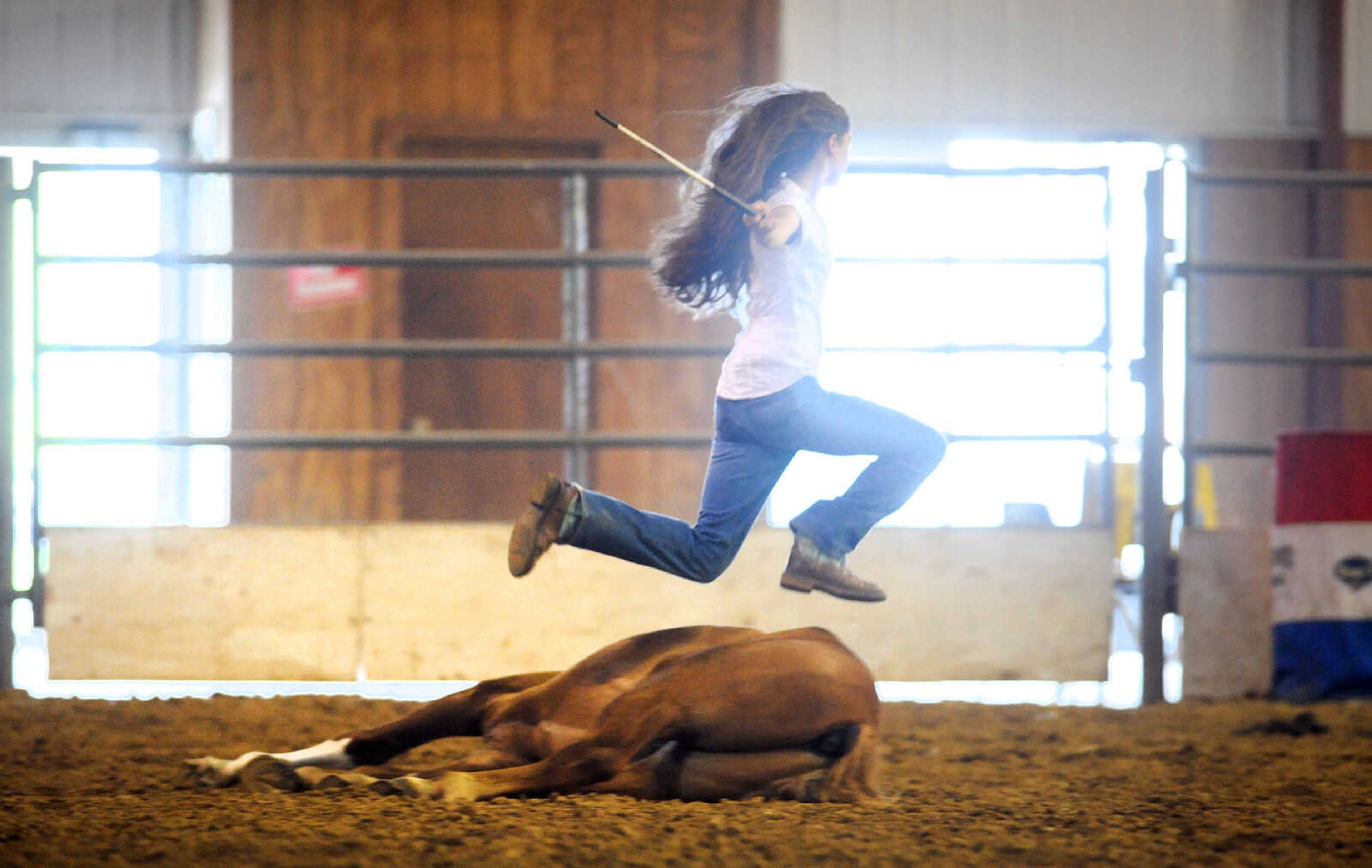 LAURA SIMON ~ lsimon@semissourian.com

Allison Elfrink and her wild mustang, Chico, at Flickerwood Arena in Jackson, Missouri, Wednesday, Aug. 5, 2015.