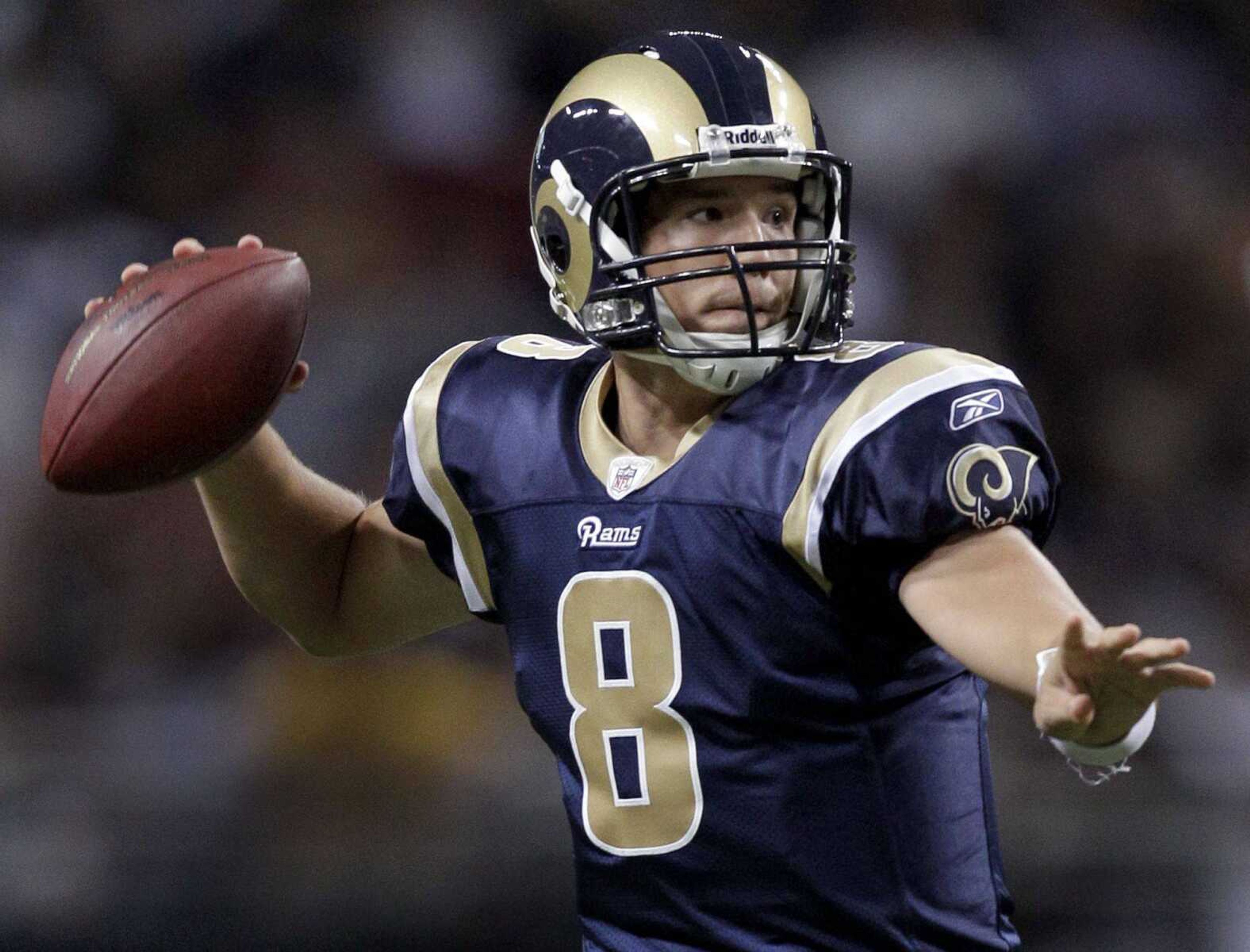 St. Louis Rams quarterback Sam Bradford drops back to pass during the first quarter of an NFL football game against the Arizona Cardinals Sunday, Sept. 12, 2010, in St. Louis. (AP Photo/Jeff Roberson)