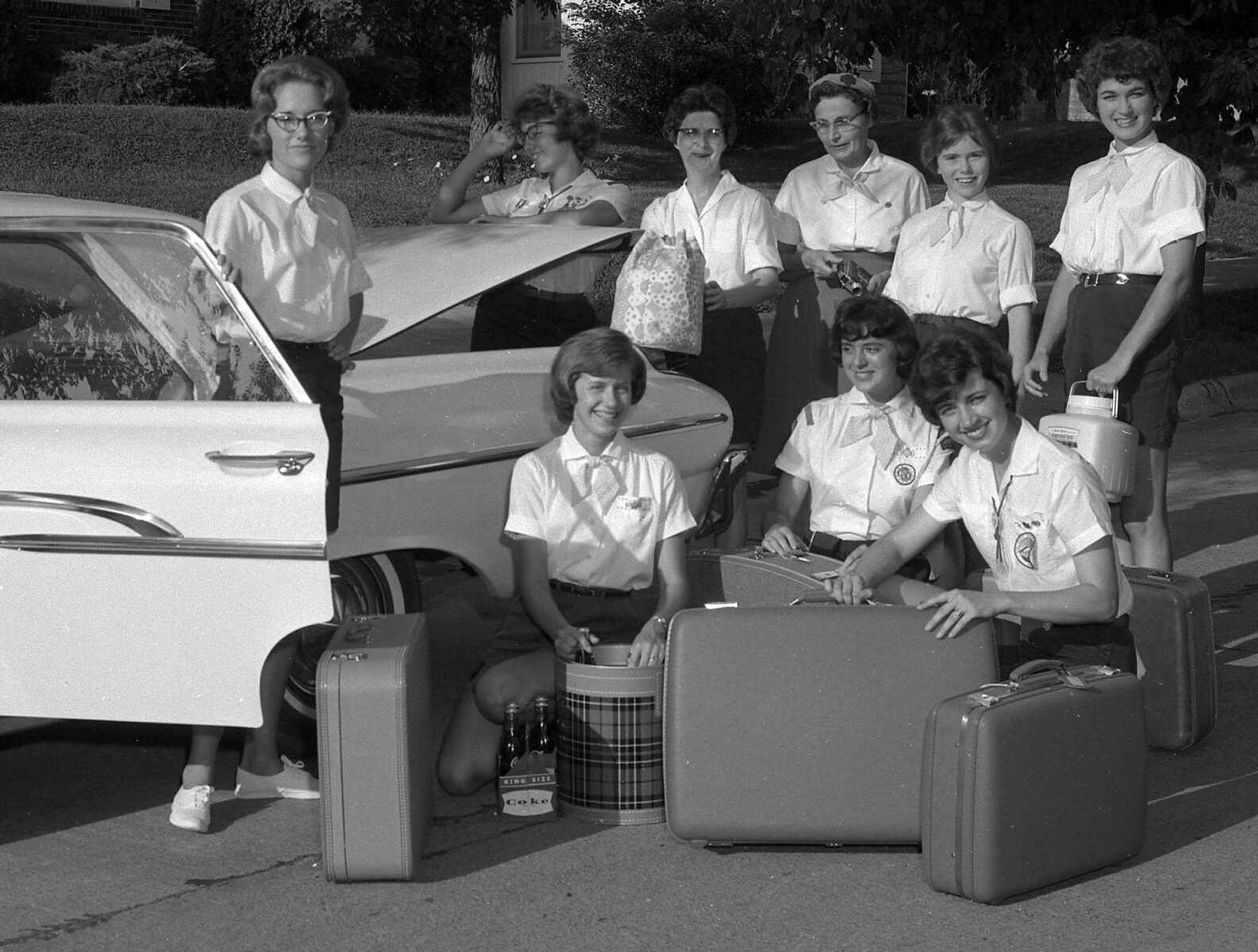 Aug. 6, 1962 Southeast Missourian.
Packing Sunday for a 10-day visit to Florida, mostly in the Bradenton area, are these Cape Girardeau Girl Scouts. They departed today. From left, foreground: Linda Lusk, Pam Stuart, Janet Bullock and Jenny Damitz; standing: Cathy Popp, Mrs. Kenneth Damitz and Mrs. John Popp, leaders, Charlene Raglan and Jeanne Taylor. (G.D. Fronabarger/Southeast Missourian archive)