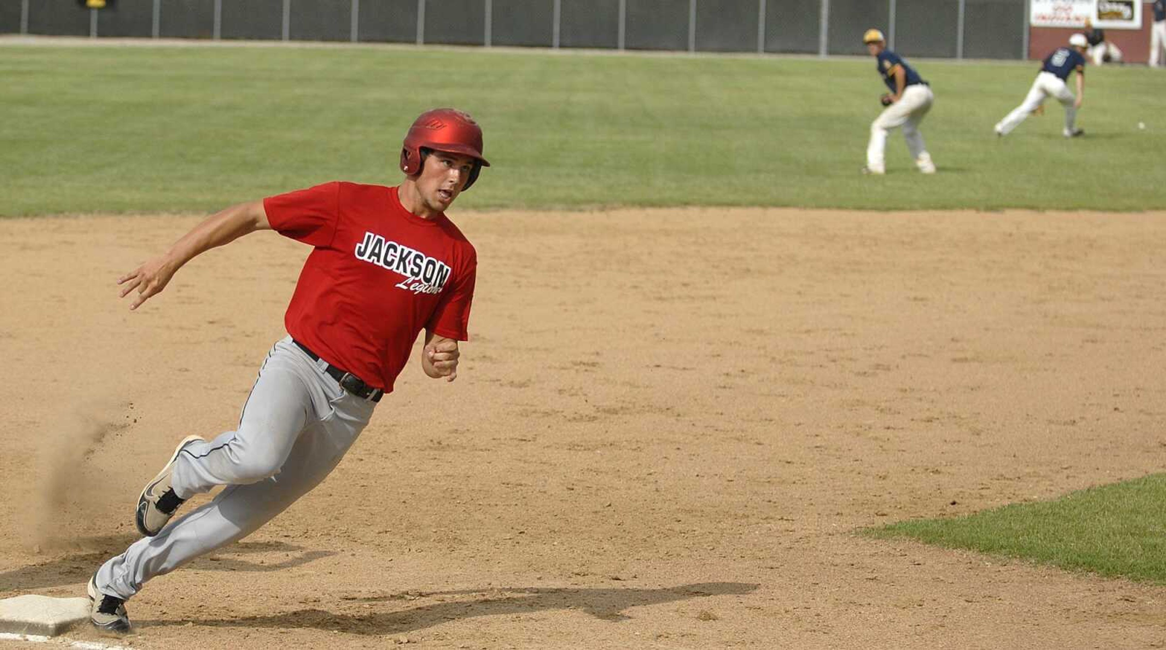 Jackson's Clayton Baker rounds third base on his way to home plate for an inside-the-park home run during the fourth inning Tuesday.