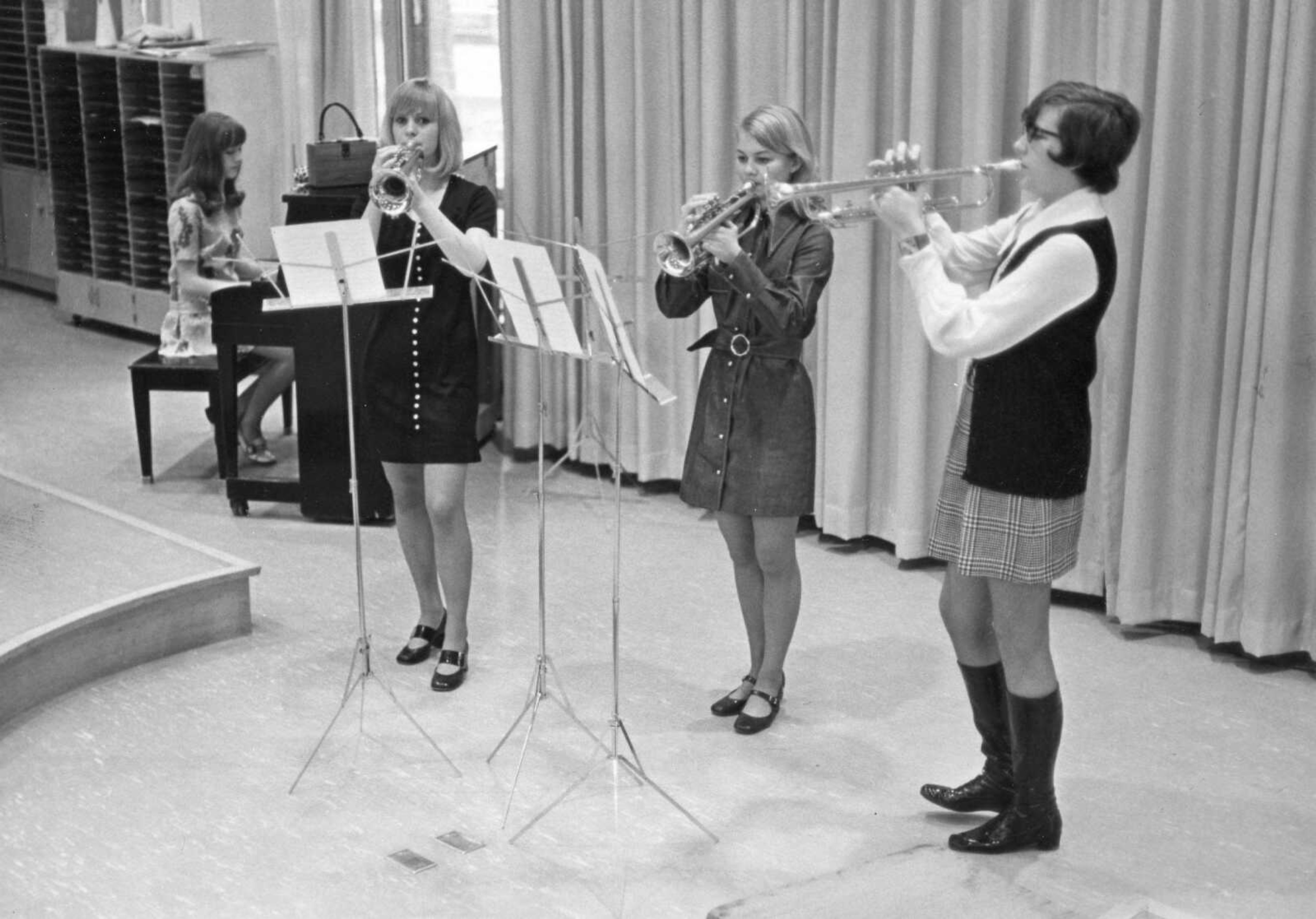 Published March 21, 1970.
High school pupils from the area were in abundance in Cape Girardeau to compete in their areas of interest. Among the young musicians in town for competition were these four girls from Charleston, Missouri. The trumpet trio, from left, was made up of Jan Huffstutter, Brenda Coffer and Lisa Fox. The pianist was Mary Ann Clark. (Southeast Missourian archive)