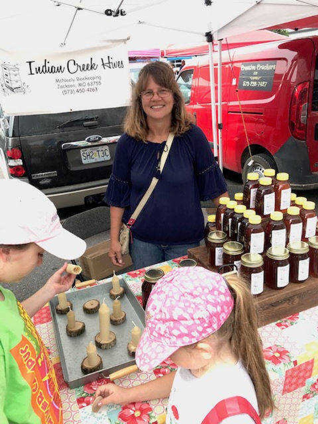 Carmen McNeely keeps bees with her husband Doug McNeely. They sell honey, lip balm, hand lotion and beeswax candles at the Cape Riverfront Farmers Market through their sideliner business, Indian Creek Hives.