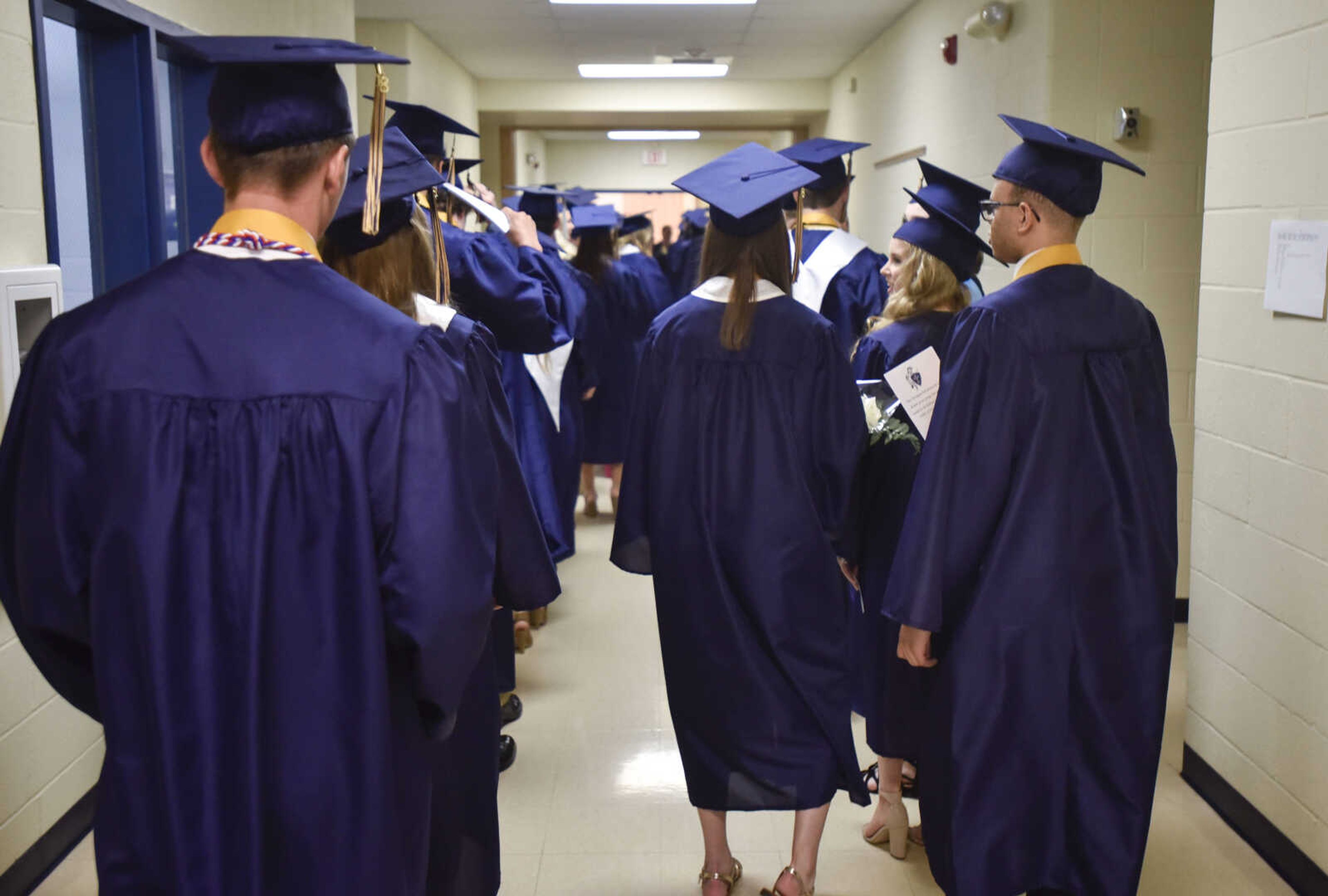 Graduates walk into their graduation ceremony Sunday, May 20, 2018 at Saxony Lutheran High School in Jackson.