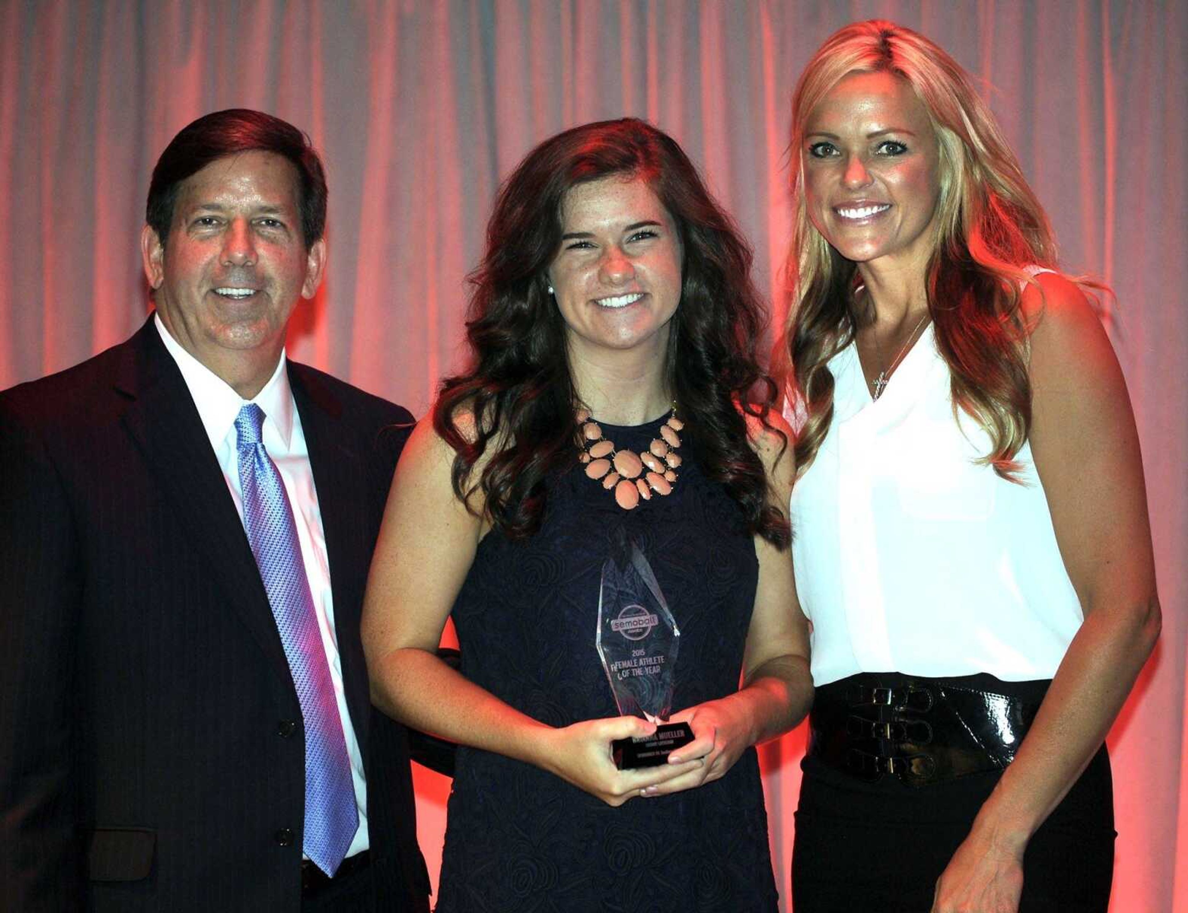 Saxony Lutheran's Brianna Mueller, left, receives the Female Athlete of the Year Award from Ken Bateman, left, president and CEO of SoutheastHEALTH, and Jennie Finch at the Semoball Awards Saturday, July 11, 2015 at the River Campus. (Fred Lynch)