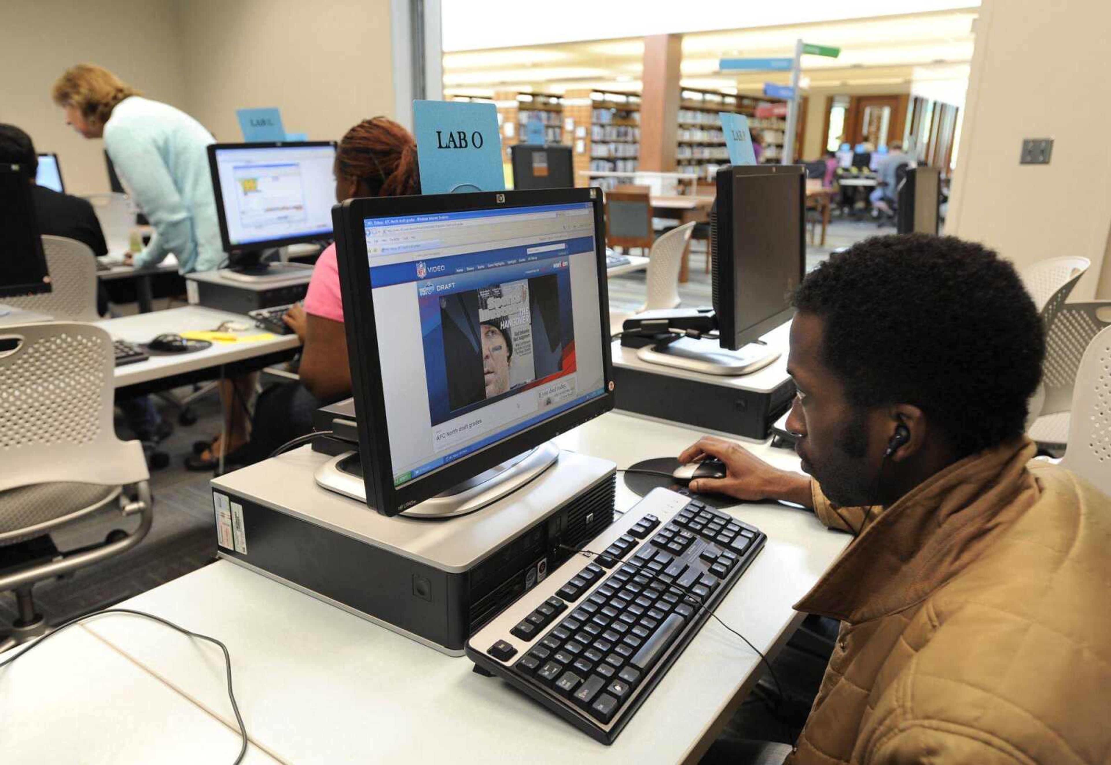 Ernest Woodard views a multimedia website Wednesday in the computer lab of the Cape Girardeau Public Library. (Fred Lynch)