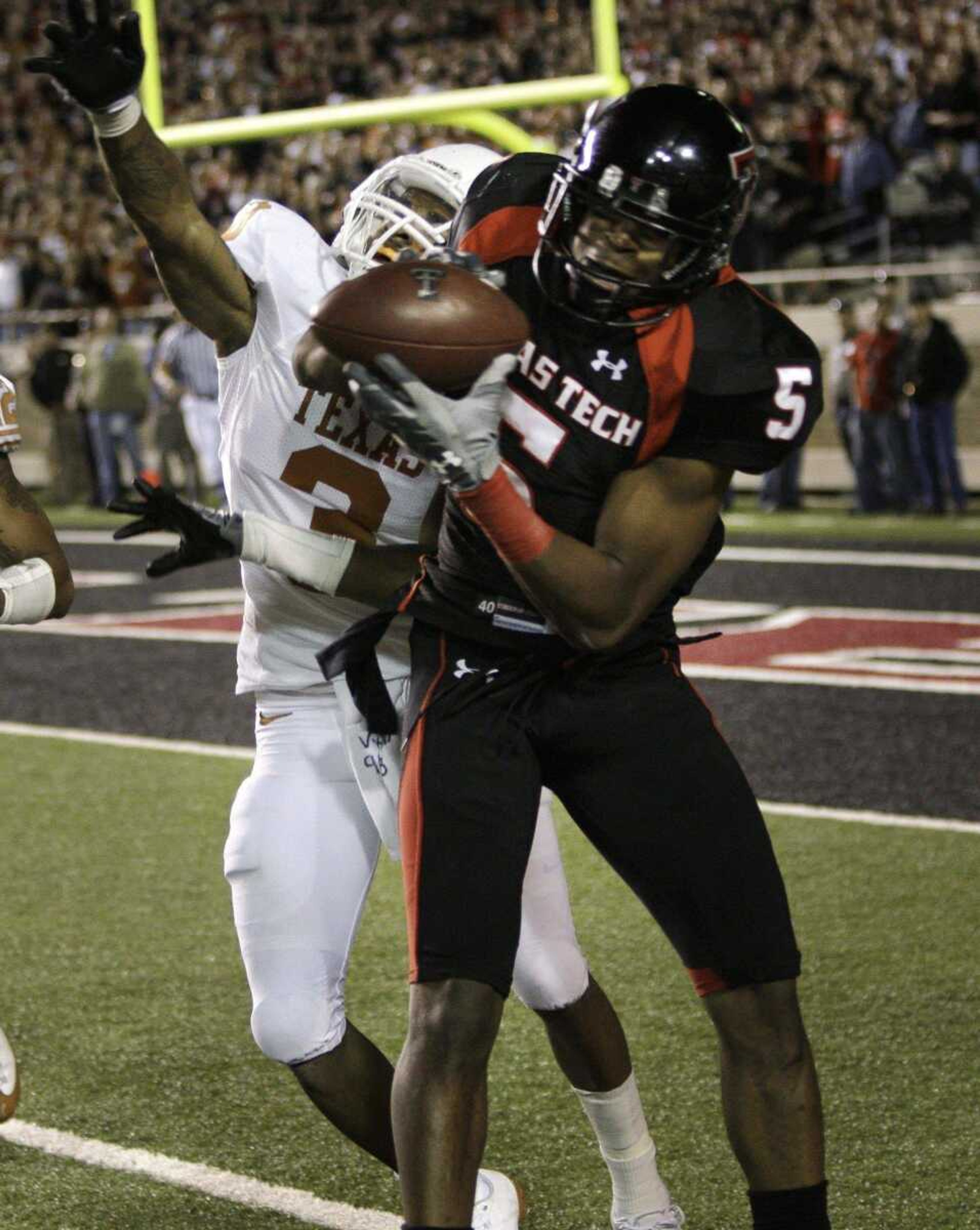 Texas Tech wide receiver Michael Crabtree pulls in the game-winning touchdown against Texas cornerback Curtis Brown.