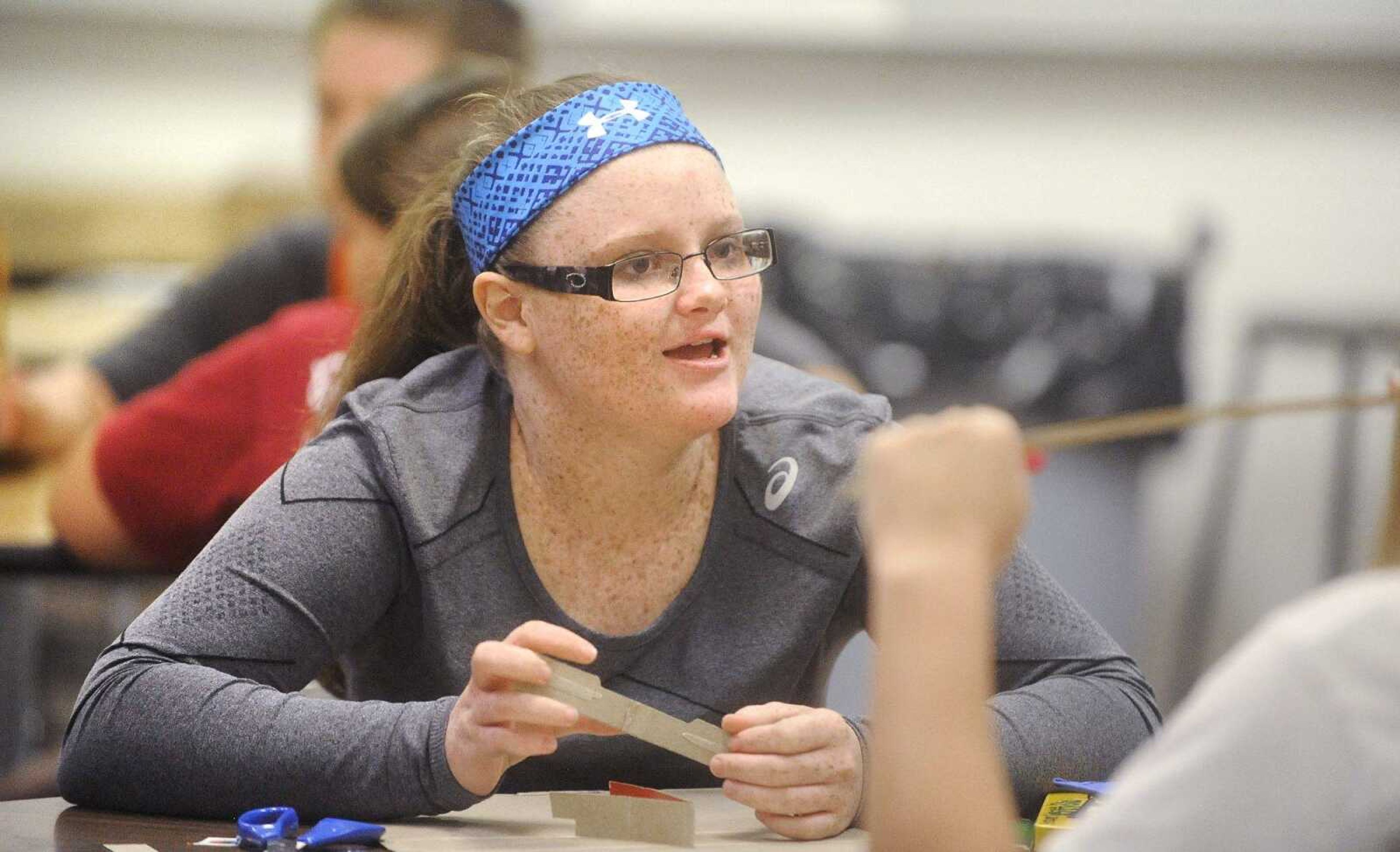 Graycen Beardslee, 13, chats with classmates during their art class, Thursday at Kelly Middle School. (Laura Simon)