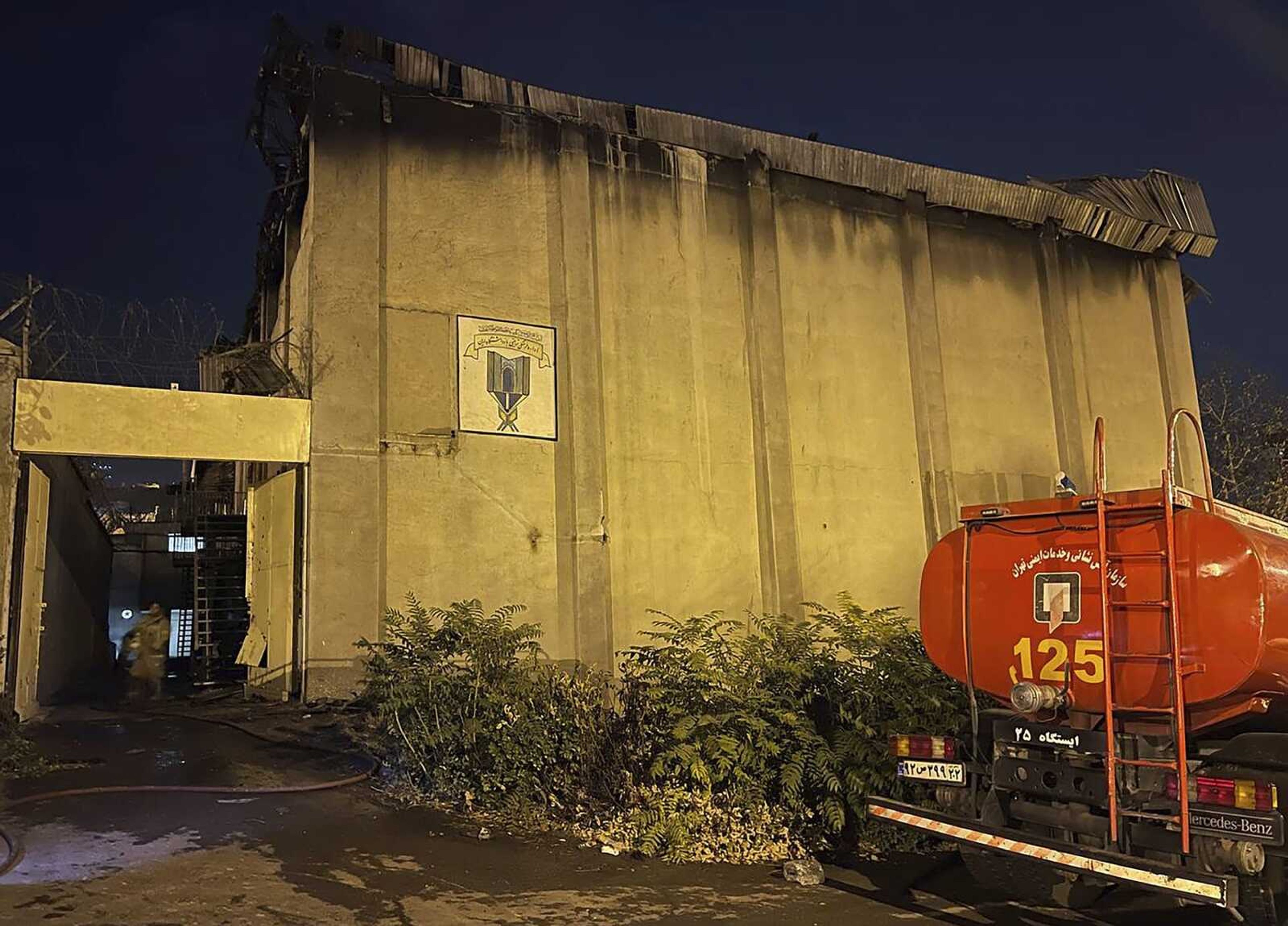 A charred building is seen Sunday, Oct. 16, after a fire on the property of the Evin prison in Tehran, Iran. Flames and smoke rising from the prison had been widely visible Saturday evening, as nationwide anti-government protests triggered by the death of a young woman in police custody entered a fifth week.