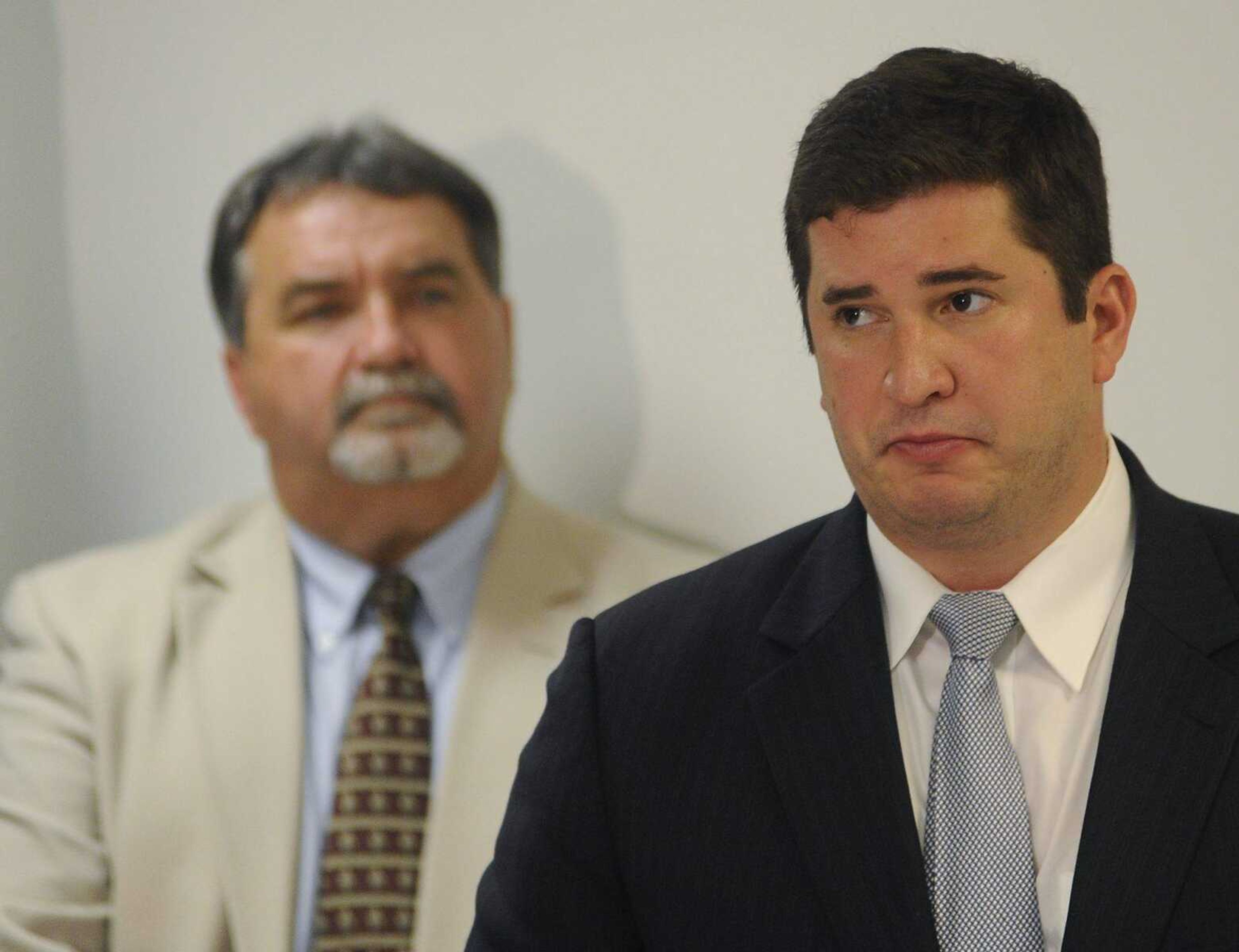 Cape Girardeau County Sheriff John Jordan watches, left, as Cape Girardeau County Prosecuting Attorney Chris Limbaugh speaks during a news conference Thursday, June 6, 2013, at the Cape Girardeau County Sheriff's Office after a hearing at the Cape Girardeau County Courthouse where Clay Waller pleaded guilty to killing his wife, Jacque Waller, on June 1, 2011. (Adam Vogler)