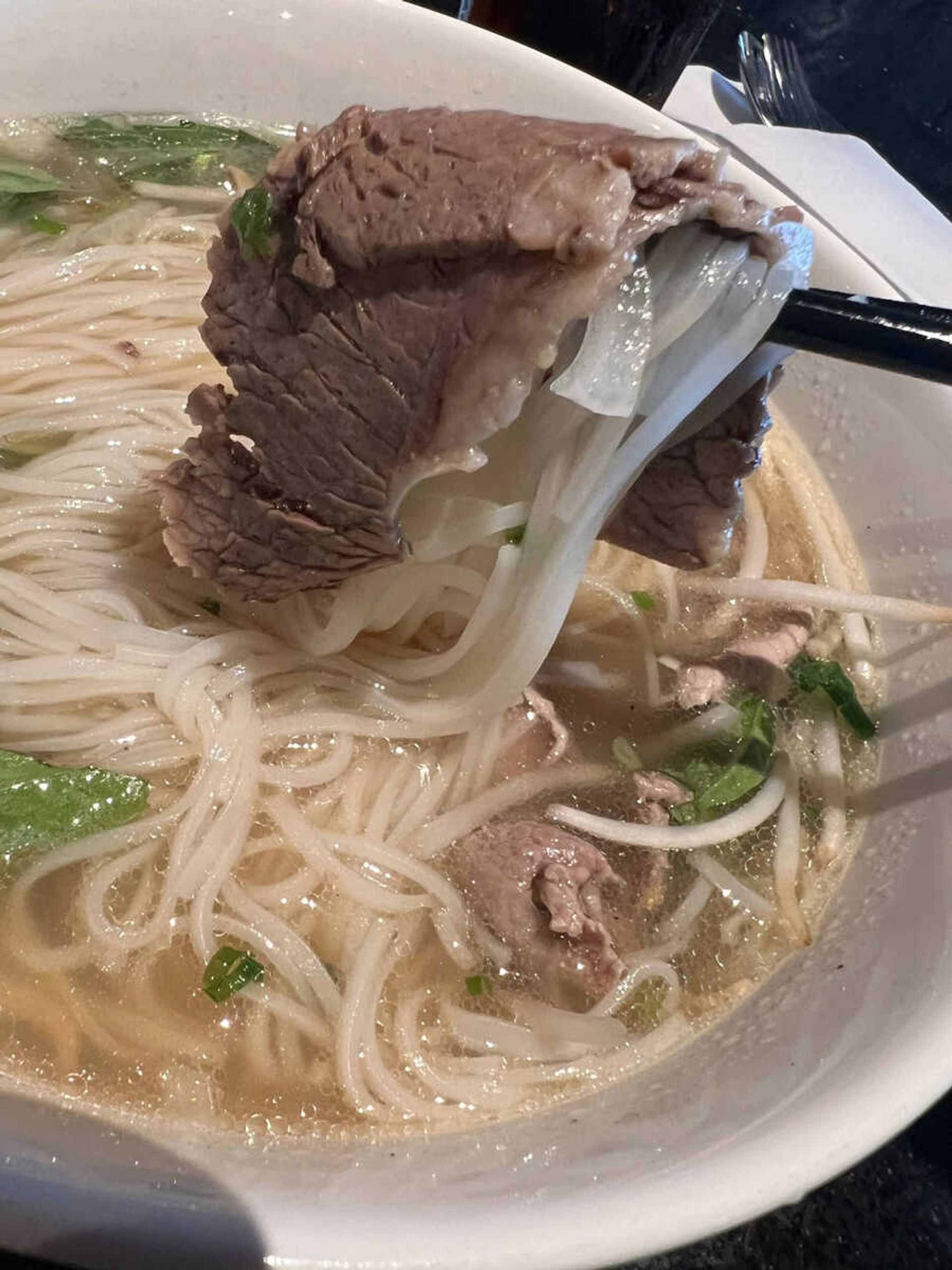 Pho's traditionally clear light broth deceptively gives no indication of the depth of flavor.