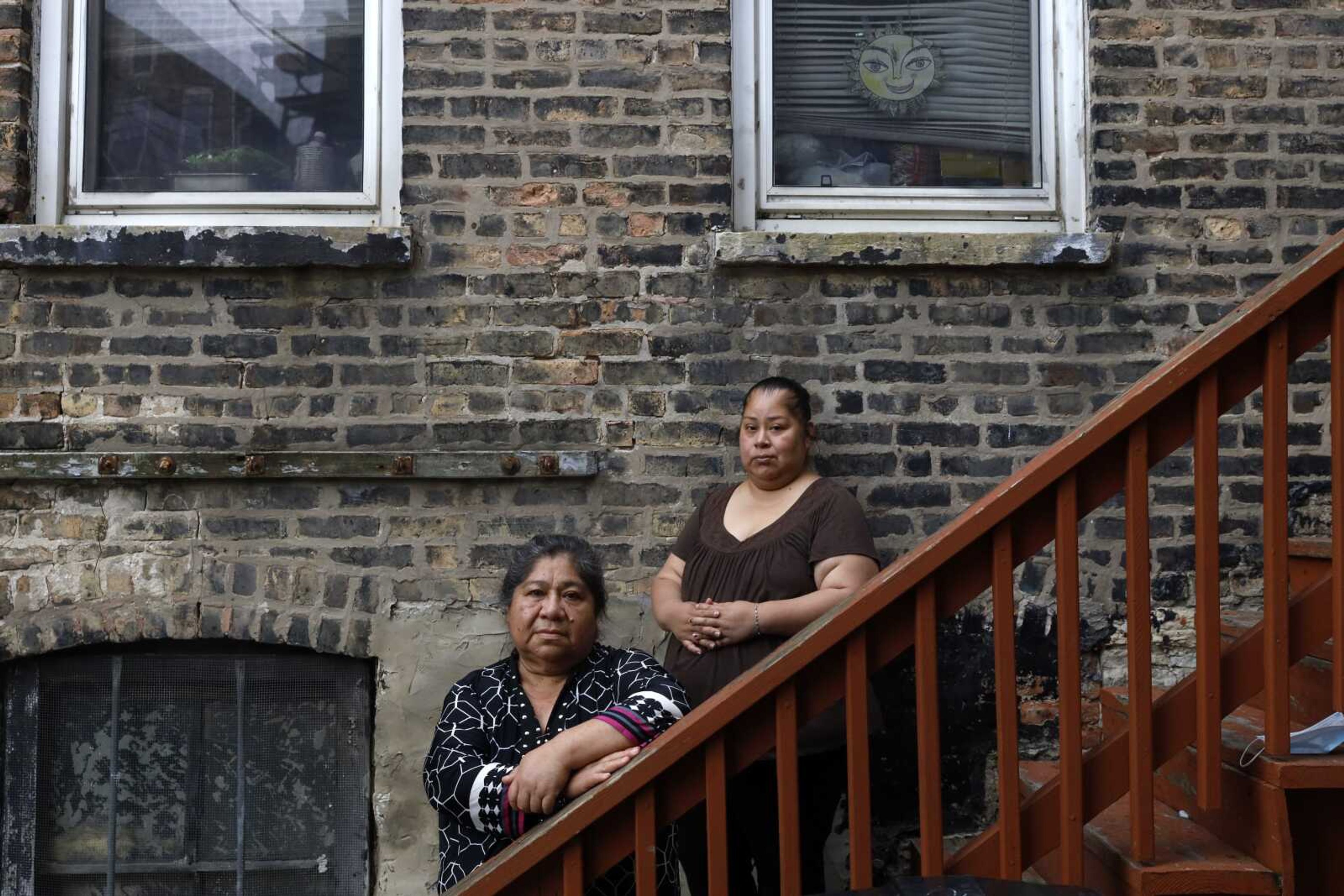 Maria Elena Estamilla, 62, left, and her daughter Esmeralda Triquiz pose for a photo June 30 in Chicago's Pilsen neighborhood. Estamilla's last full medical exam was in 2015 and she sees no options for care as a Mexican immigrant without legal permission to live in the U.S. She's not eligible for Medicare, Medicaid or Affordable Care Act coverage. As a child care worker, she didn't have employer coverage. She can't afford private insurance.