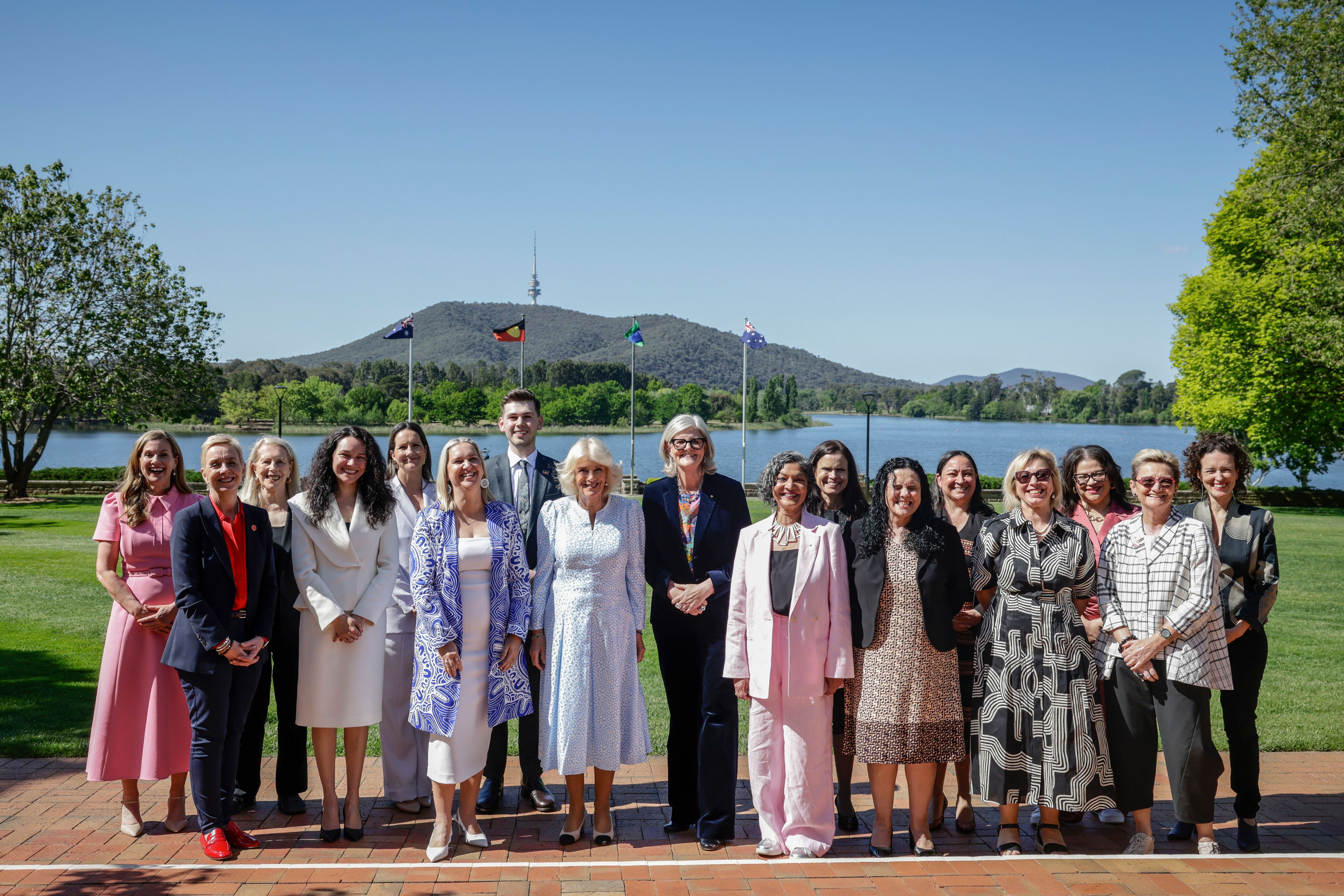 Britain's Queen Camilla, center left, joins Australia's Governor-General Sam Mostyn, center, and Executive Director of the Office for Women (OFW) at the Department of the Prime Minister and Cabinet Padma Raman, center right, for a group photo during discussion on family and domestic violence at Government House in Yarralumla in Canberra, Australia, Monday, Oct. 21, 2024. (Brook Mitchell/Pool Photo via AP)