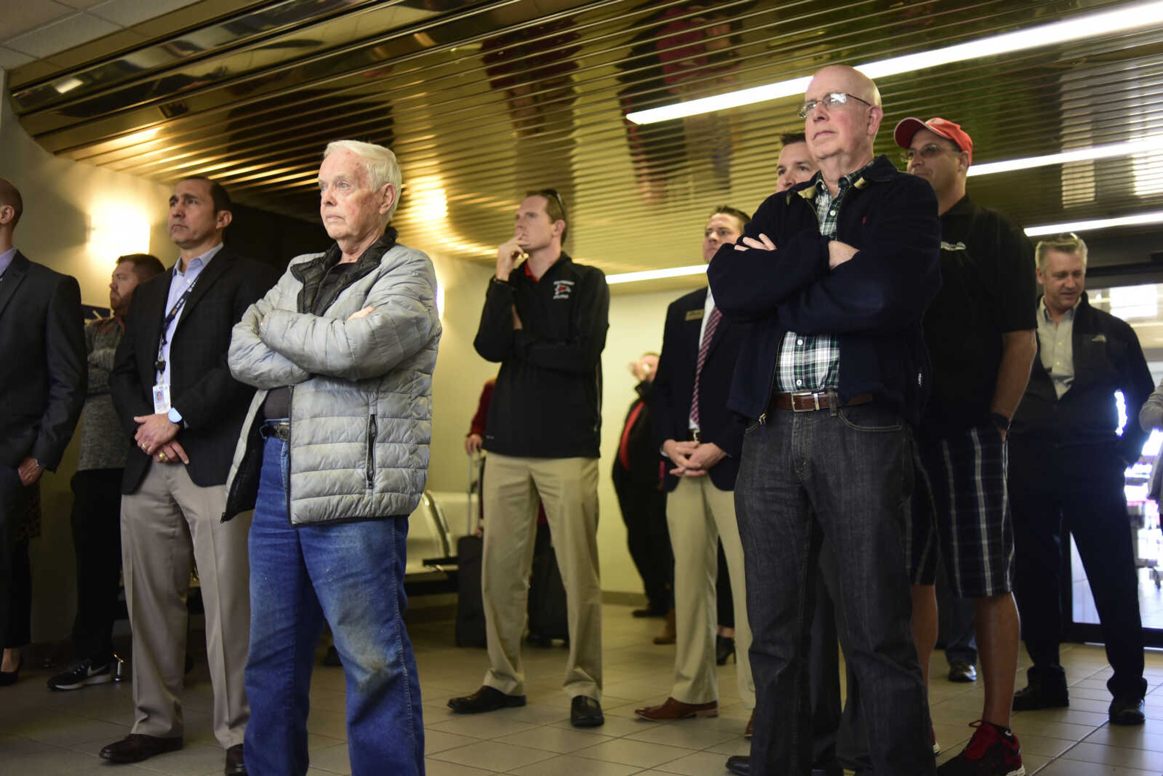 People listen to Bruce Loy speak during the inaugural trip to Chicago on a CRJ200 airplane with SkyWest Friday, Dec. 1, 2017 at Cape Girardeau Regional Airport in Cape Girardeau.