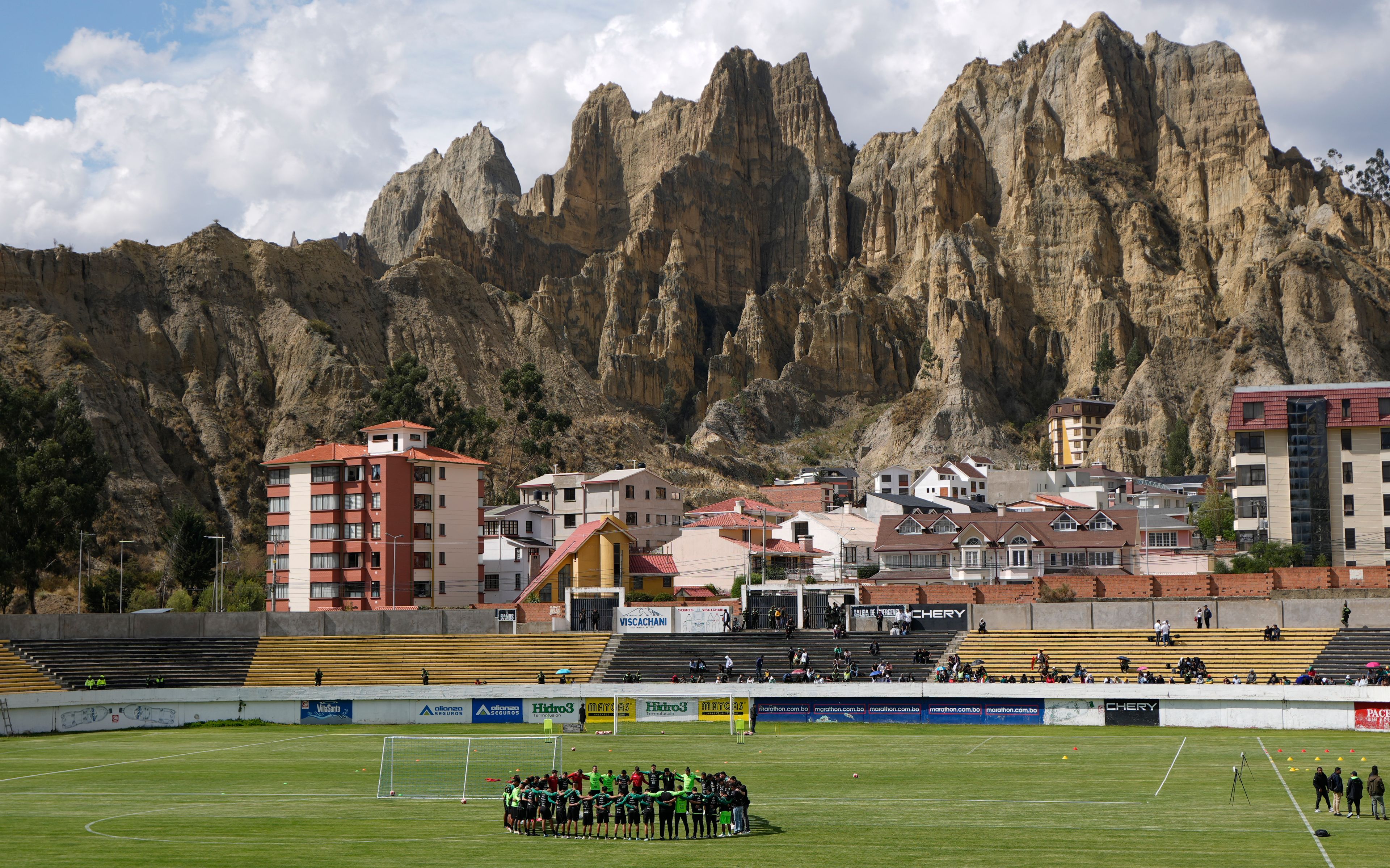 Bolivia's national soccer team huddles during a training season ahead of a World Cup qualifier against Colombia, in La Paz, Bolivia, Wednesday, Oct. 9, 2024. (AP Photo/Juan Karita)