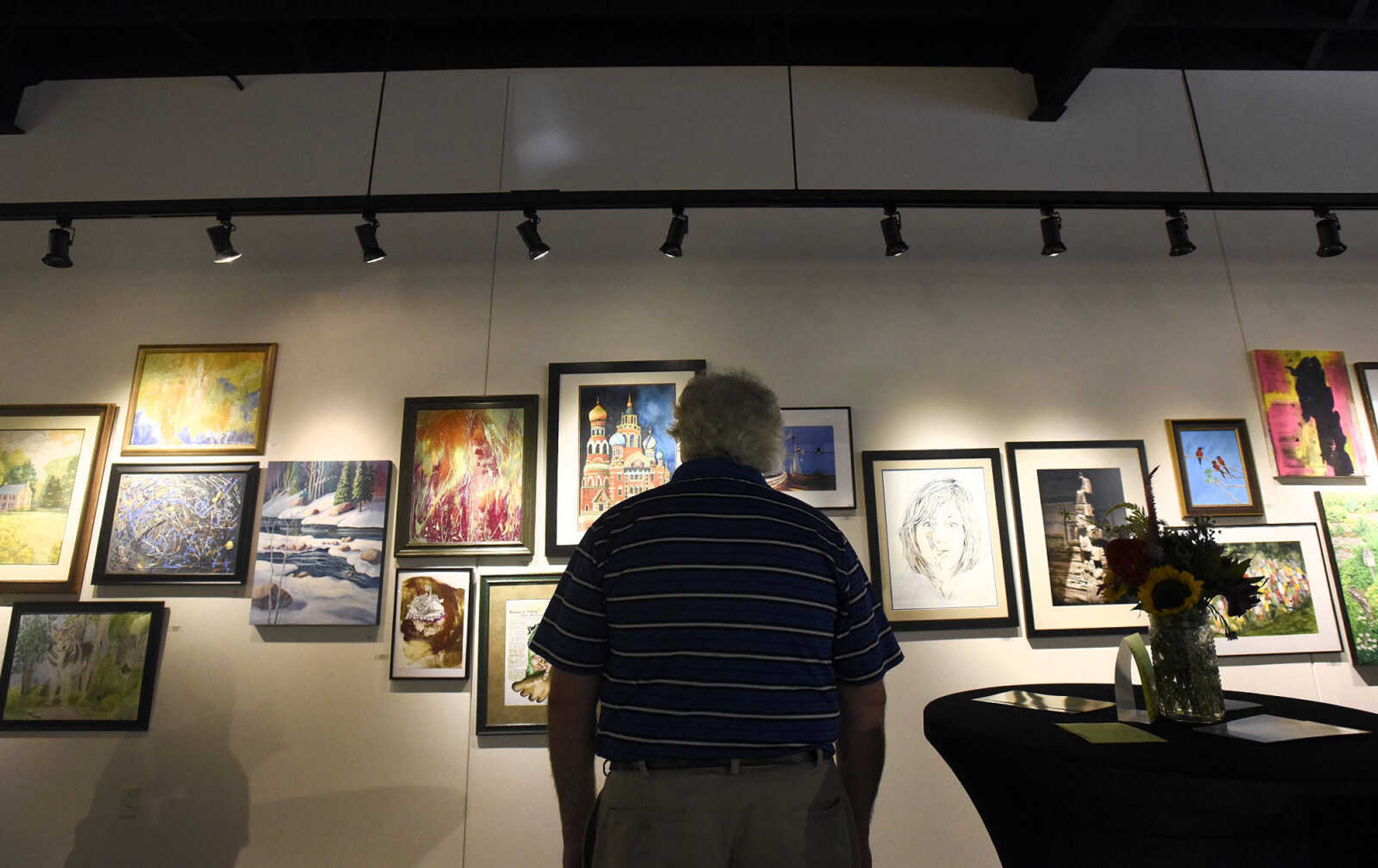 LAURA SIMON ~ lsimon@semissourian.com

People take in the grand opening reception for the 4th annual Members Exhibit at the Arts Council of Southeast Missouri in its new location at 16 North Spanish Street in downtown Cape Girardeau on Friday, Sept. 2, 2016.