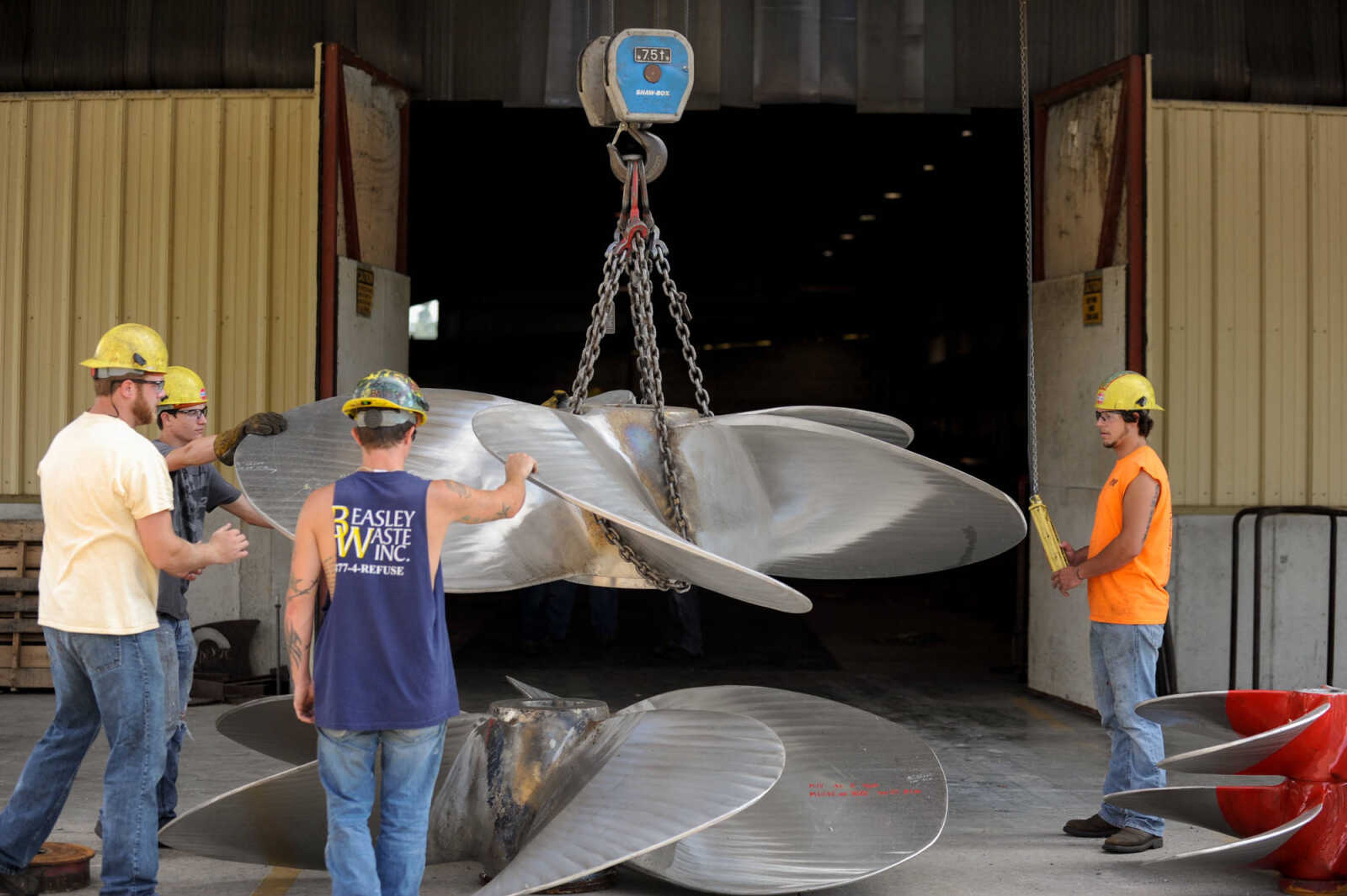 GLENN LANDBERG ~ glandberg@semissourian.com

A group of welders at Missouri Dry Dock and Repair Co. in Cape Girardeau help relocate propellers Wednesday, July 28, 2016.