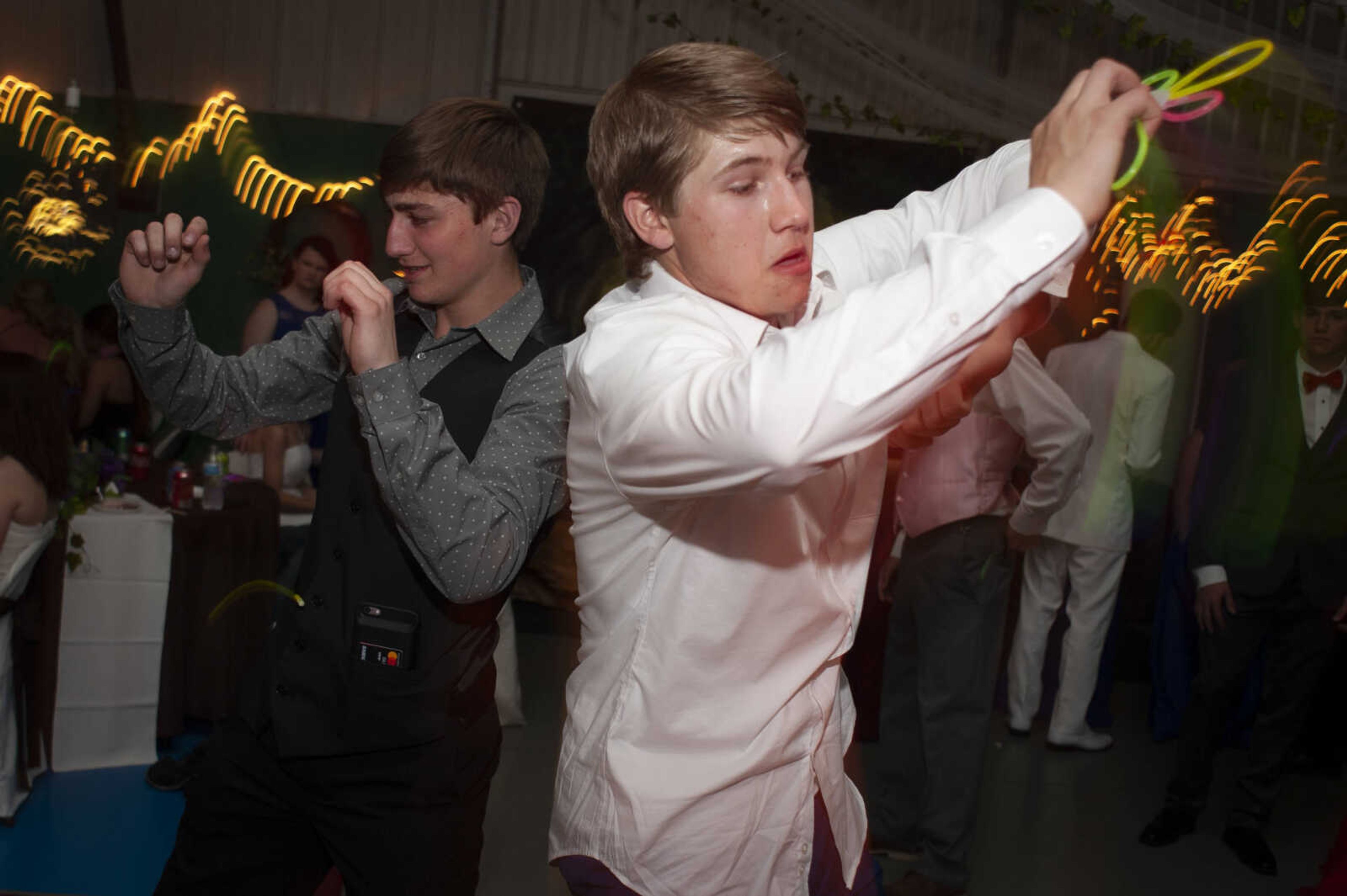 Delta junior Grant Coomer, right, and Delta sophomore Dyllan Kohler dance during Delta High School's prom on Saturday, April 13, 2019, at the Delta Community Center.