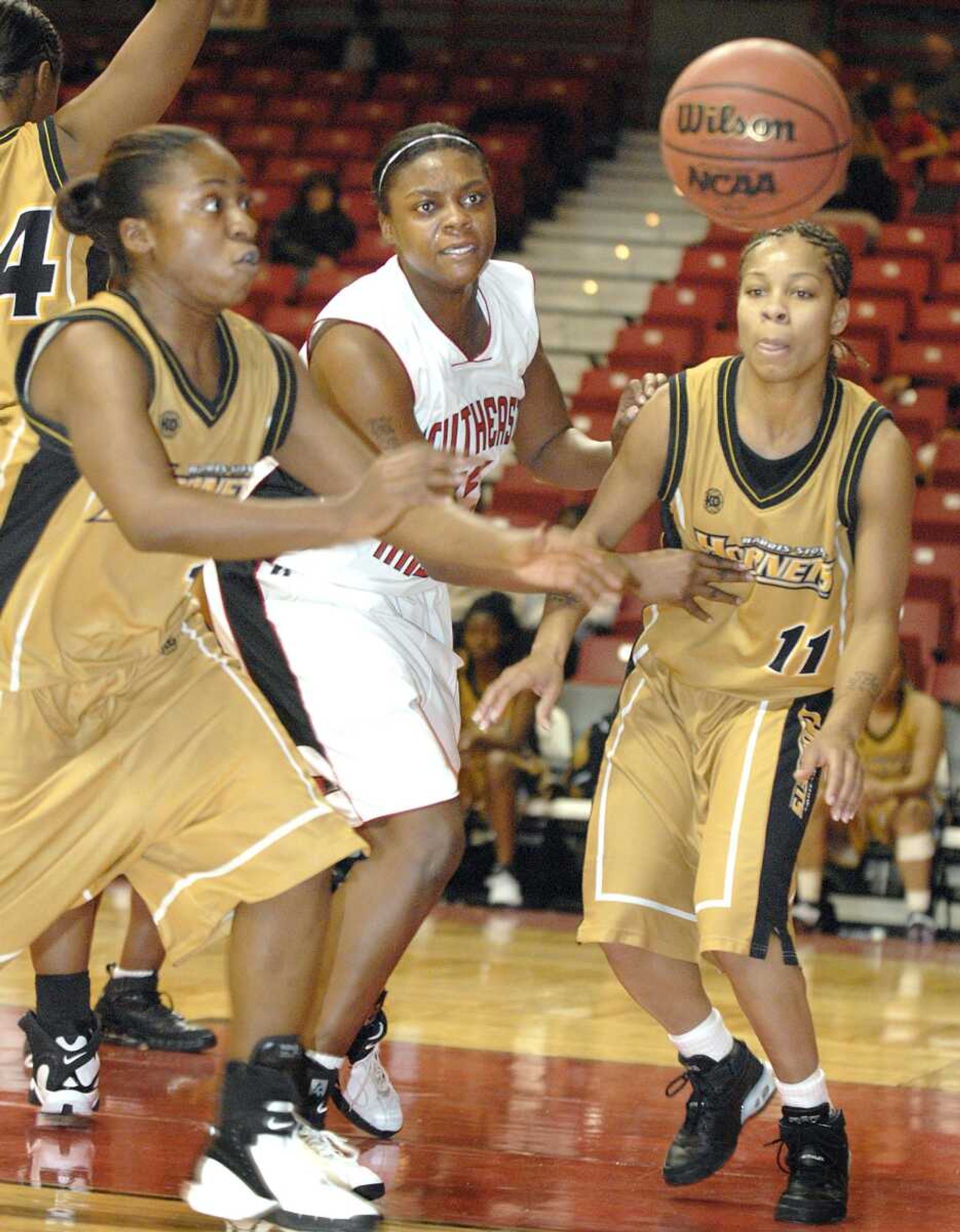 Missy Whitney, center, went for a loose ball with Harris-Stowe's Camron Weaver, left, and Chanel Ross during the first half of Tuesday's game at the Show Me Center. (DON FRAZIER ~ dfrazier@semissourian.com)