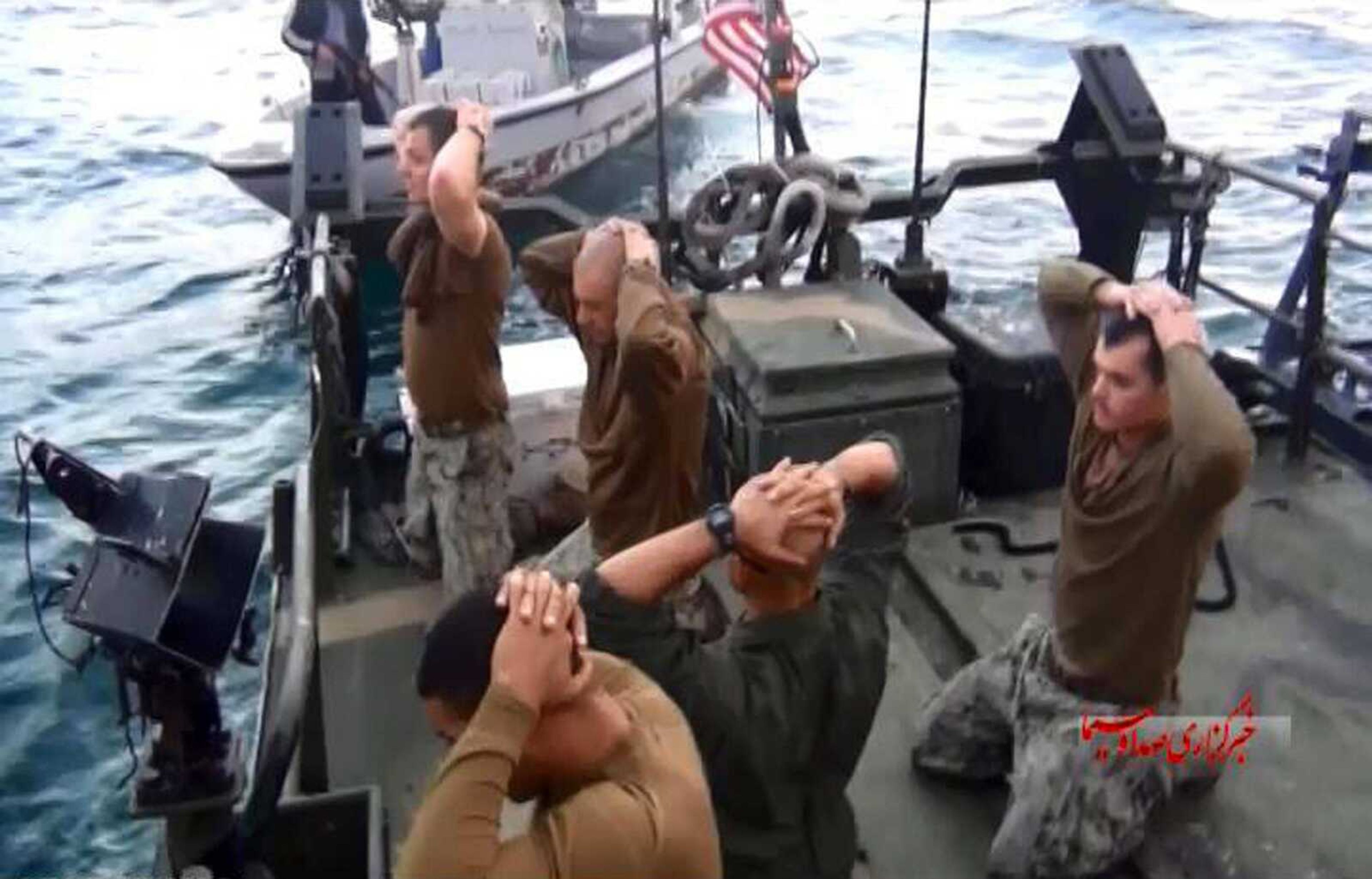 This image from a video Tuesday shows the detention of U.S. Navy sailors by Iranian Revolutionary Guards in the Persian Gulf. The 10 sailors detained by Iran after their two small boats allegedly drifted into Iranian territorial waters have been freed. (IRIB News Agency via AP)