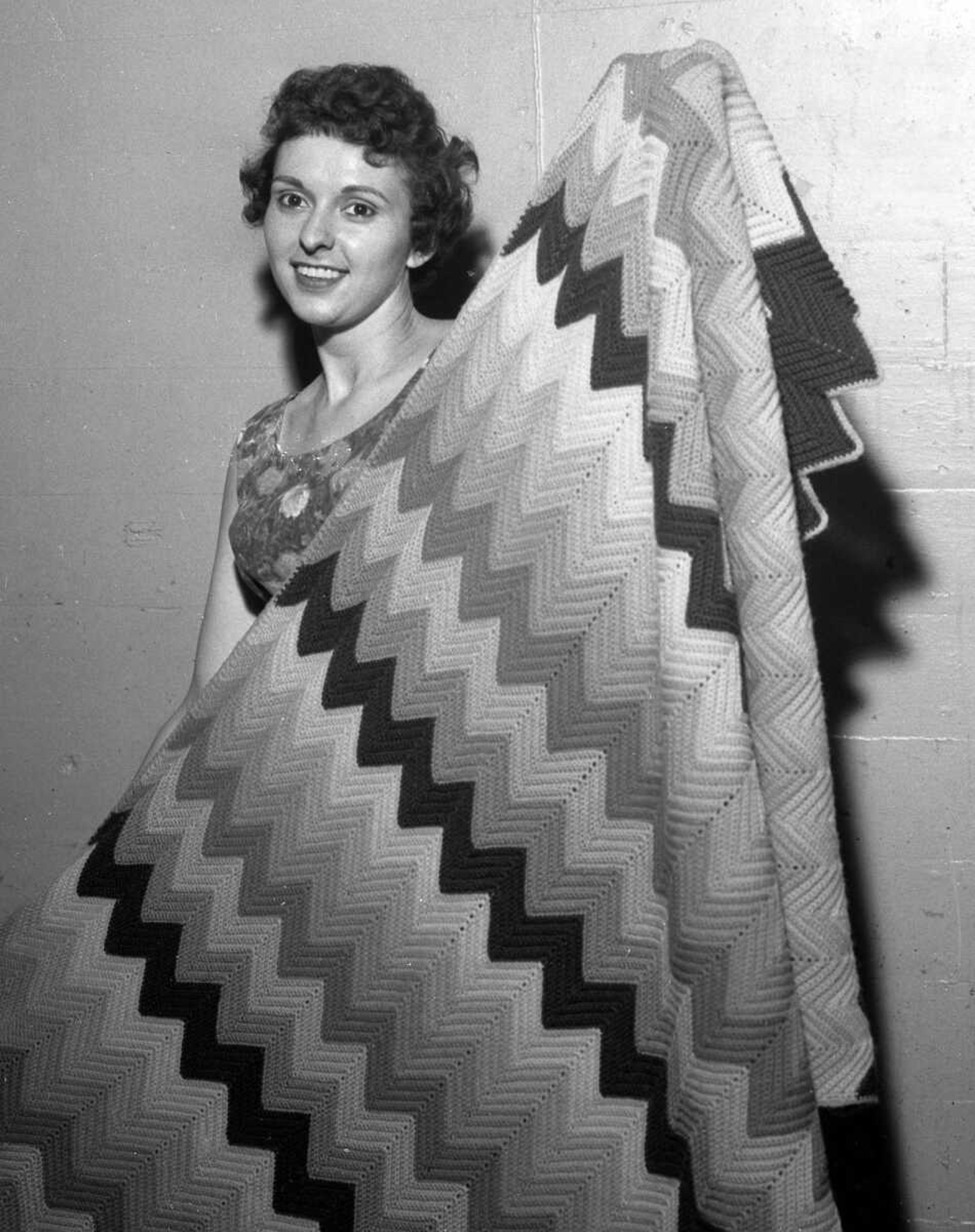 Just as they do today, women like to display their sewing skills at the SEMO District Fair. We believe this unidentified woman was showing off the afghan she made in this undated photo.