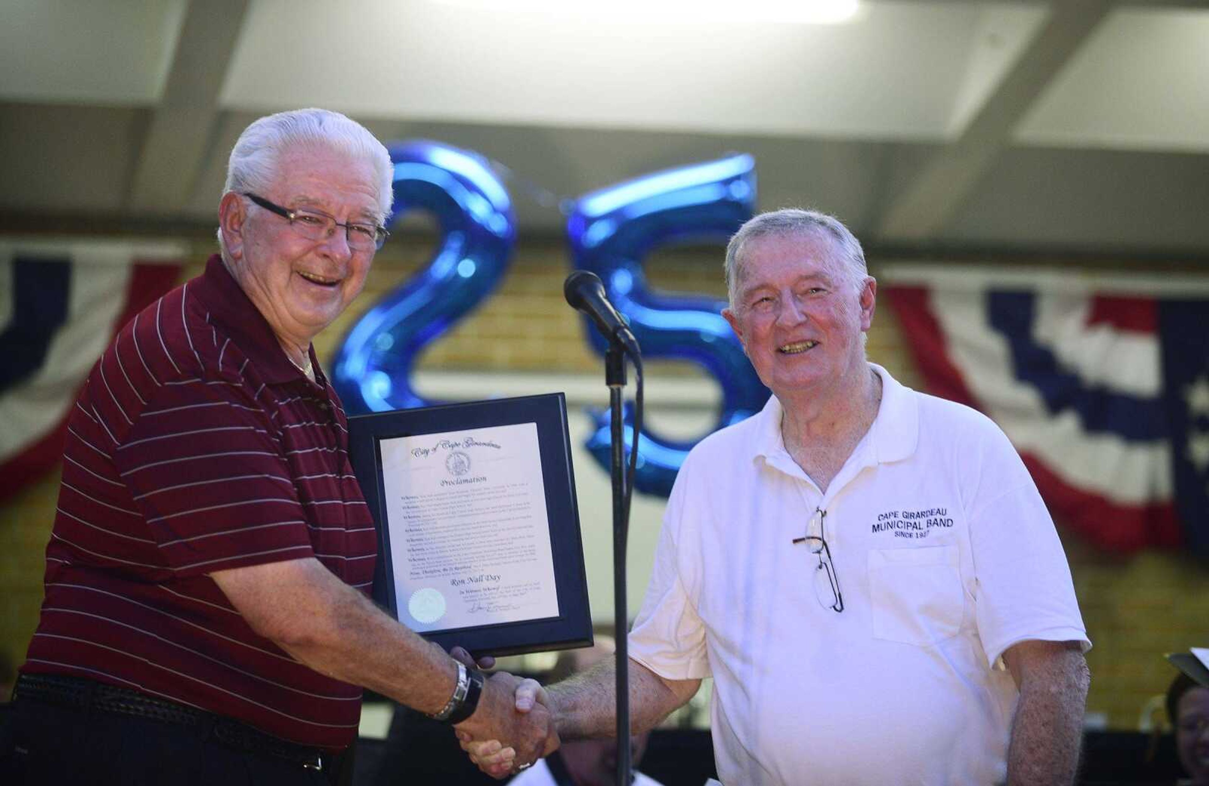 Cape Girardeau Mayor Harry Rediger (left) declared July 12, 2017, Ron Nall Day on Wednesday night at Capaha Park. Nall has been conducting the Cape Girardeau Municipal Band for 25 years.