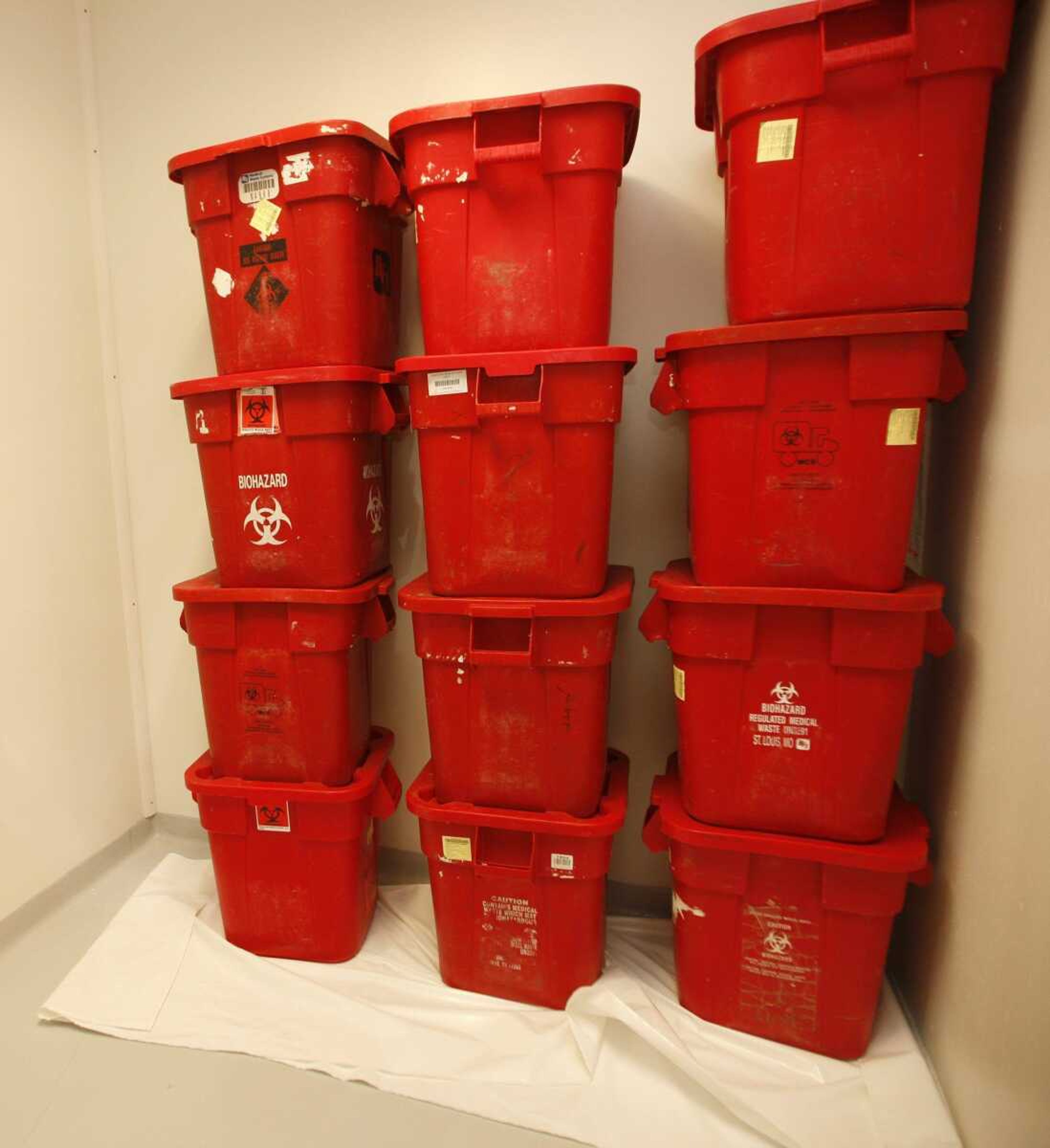 Containers holding unidentified body parts are stored by the Wyandotte County coroner Tuesday, in Kansas City, Kan. The body parts were discovered in a truck at a medical waste company. (ORLIN WAGNER ~ Associated Press)