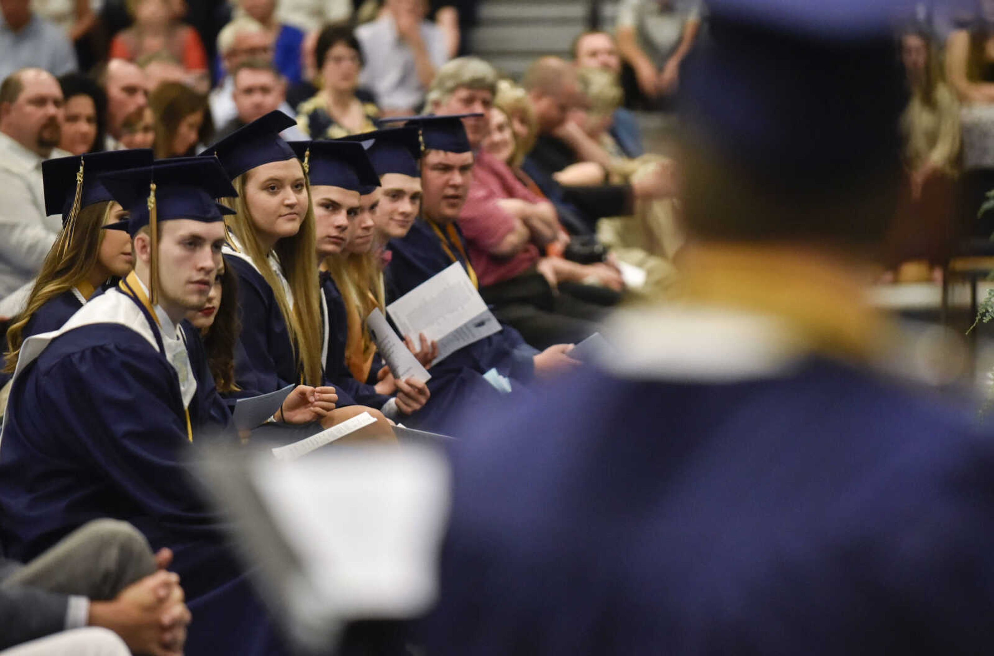 Graduates listen to members of their class perform "All Star" during their graduation ceremony Sunday, May 20, 2018 at Saxony Lutheran High School in Jackson.