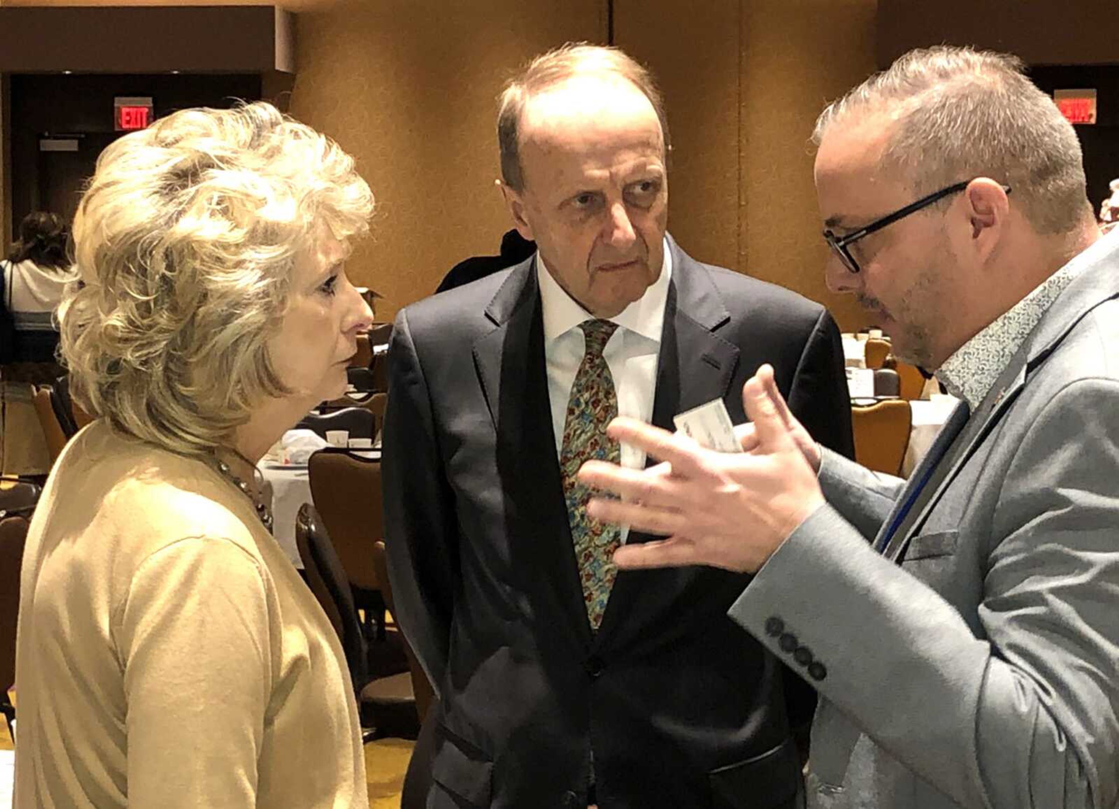 Century Casinos chairman and co-CEO Erwin Haitzmann, center, and state Rep. Kathy Swan, left, of Cape Girardeau listen to Century Casino Cape Girardeau vice president and general manager Lyle Randolph following the Cape Girardeau Area Chamber of Commerce First Friday Coffee on Friday at the casino.