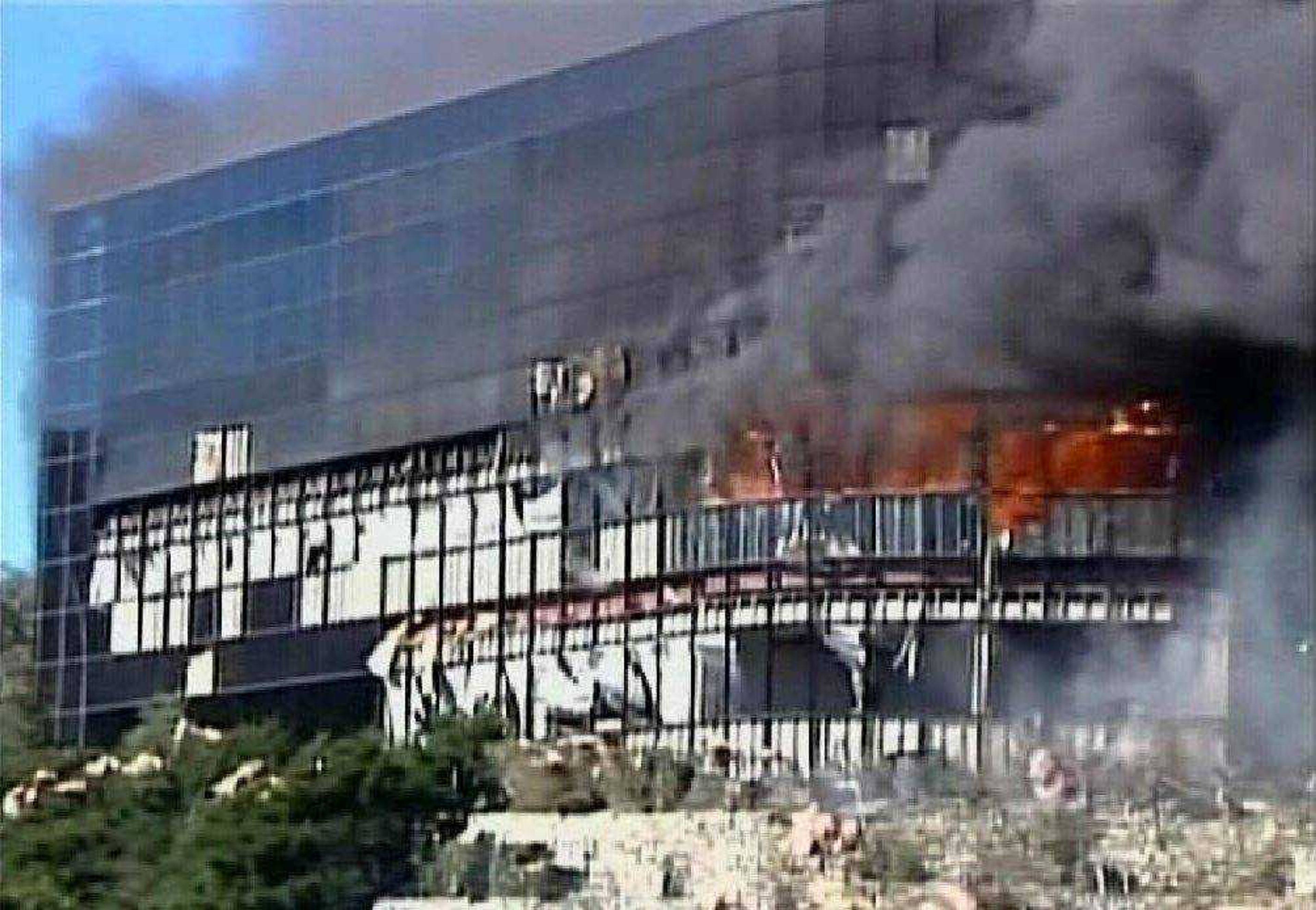 In this image made from KVUE-TV video, smoke billows from a seven-story building after a small private plane crashed into the building  in Austin, Texas on Thursday Feb. 18, 2010. (AP Photo/KVUE-TV)