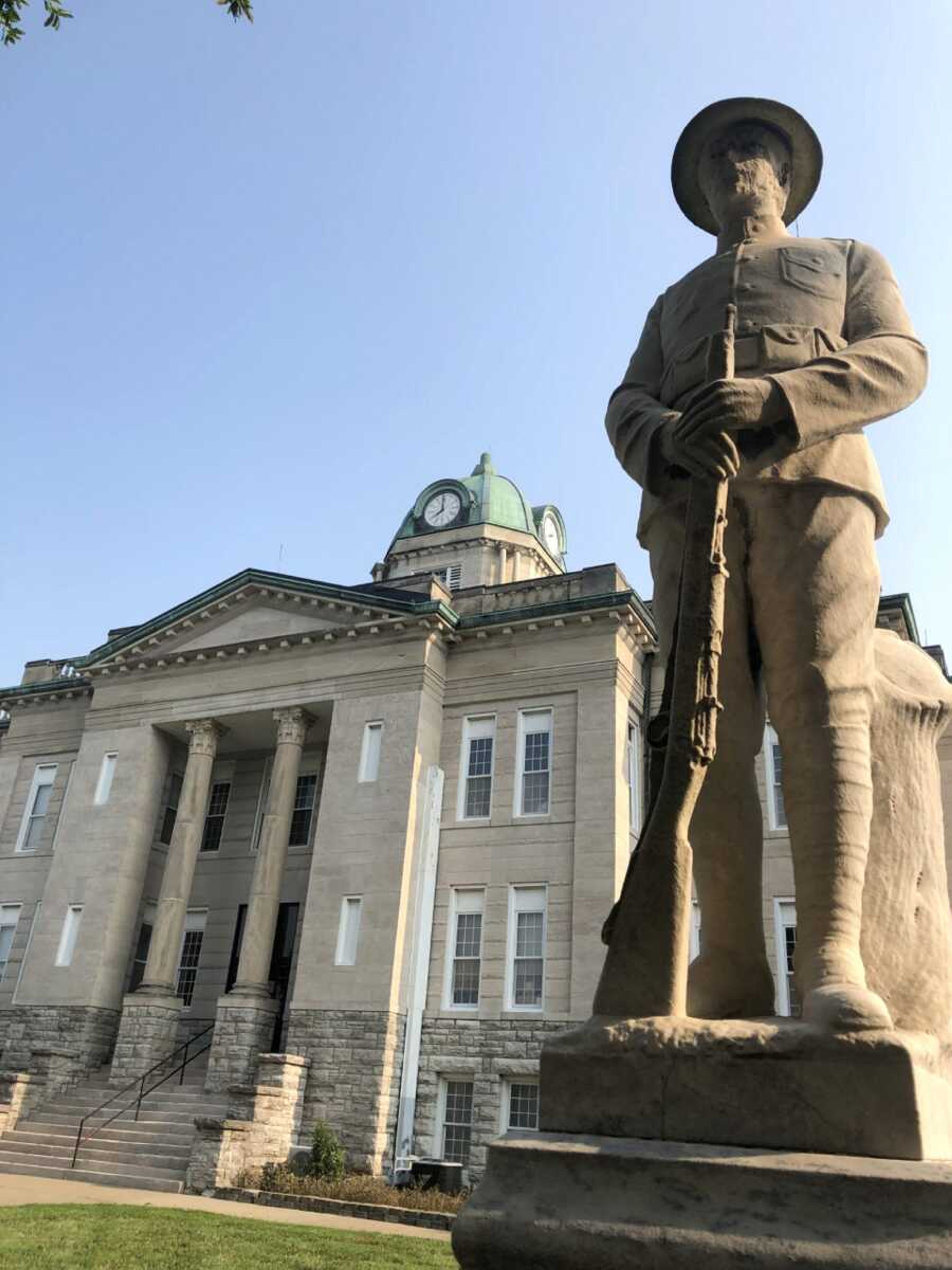 A statue honoring Cape Girardeau County residents who died in World War I stands guard Thursday in front of the old county courthouse. The Cape Girardeau County Commission authorized a study Thursday to help determine the best use for the vacant courthouse as well as other county facilities.