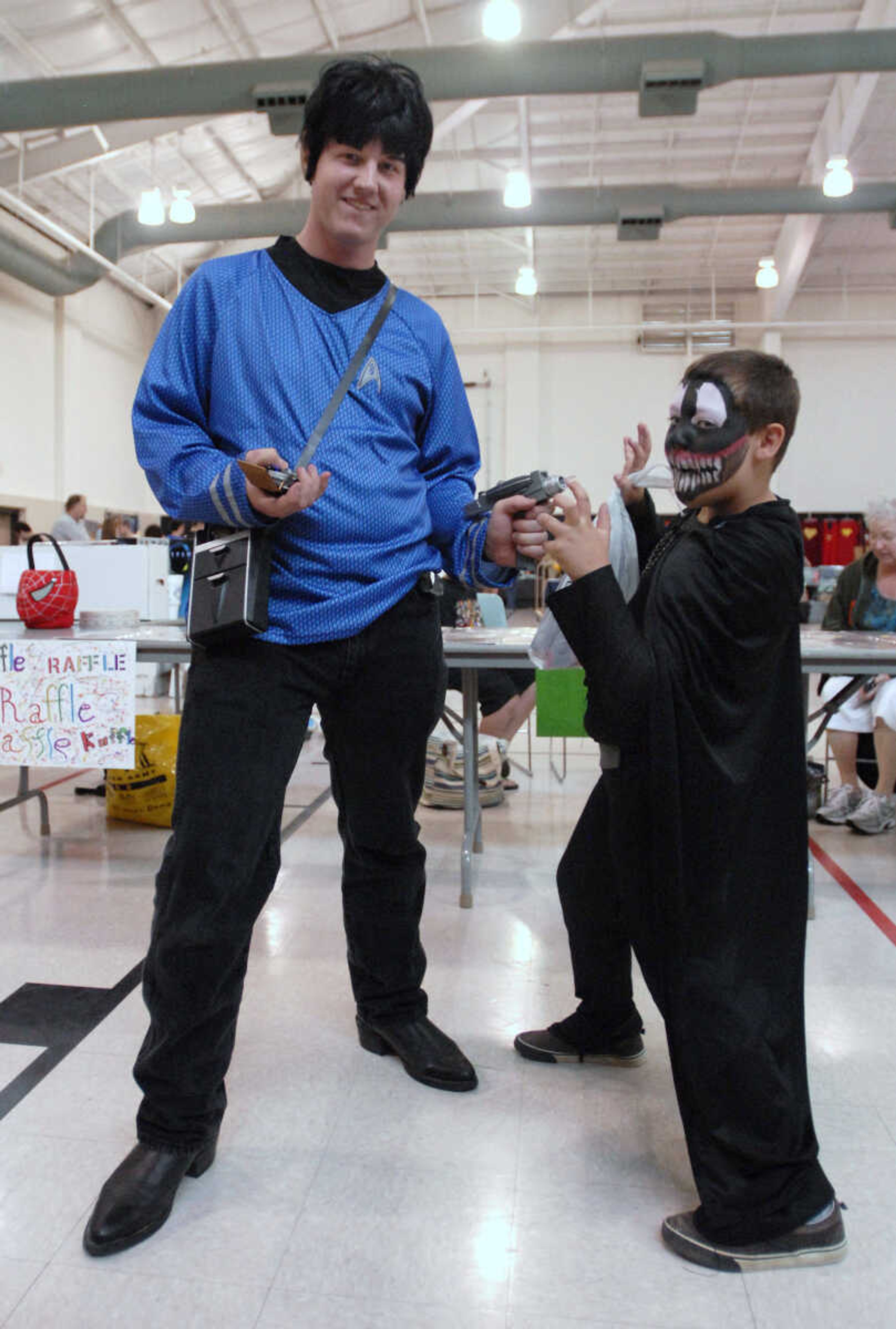 KRISTIN EBERTS ~ keberts@semissourian.com

Nathan Wareing, as Spock, left, and Hayden Scott, 8, dressed as a combination of Darth Vader and Venom pose during the sixth annual Cape Comic Con on Saturday, June 25, 2011, at the Osage Centre in Cape Girardeau.