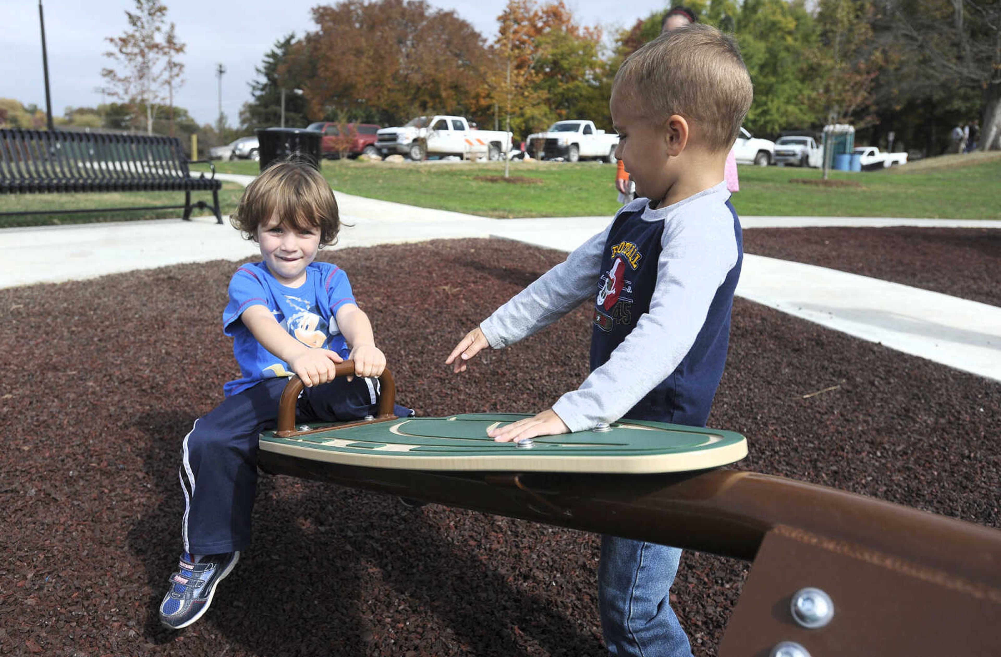 LAURA SIMON ~ lsimon@semissourian.com

Jonah Roth, right, helps bounce Sean Antill on the teeter totter at Capaha Park, Friday, Oct. 23, 2015, in Cape Girardeau.