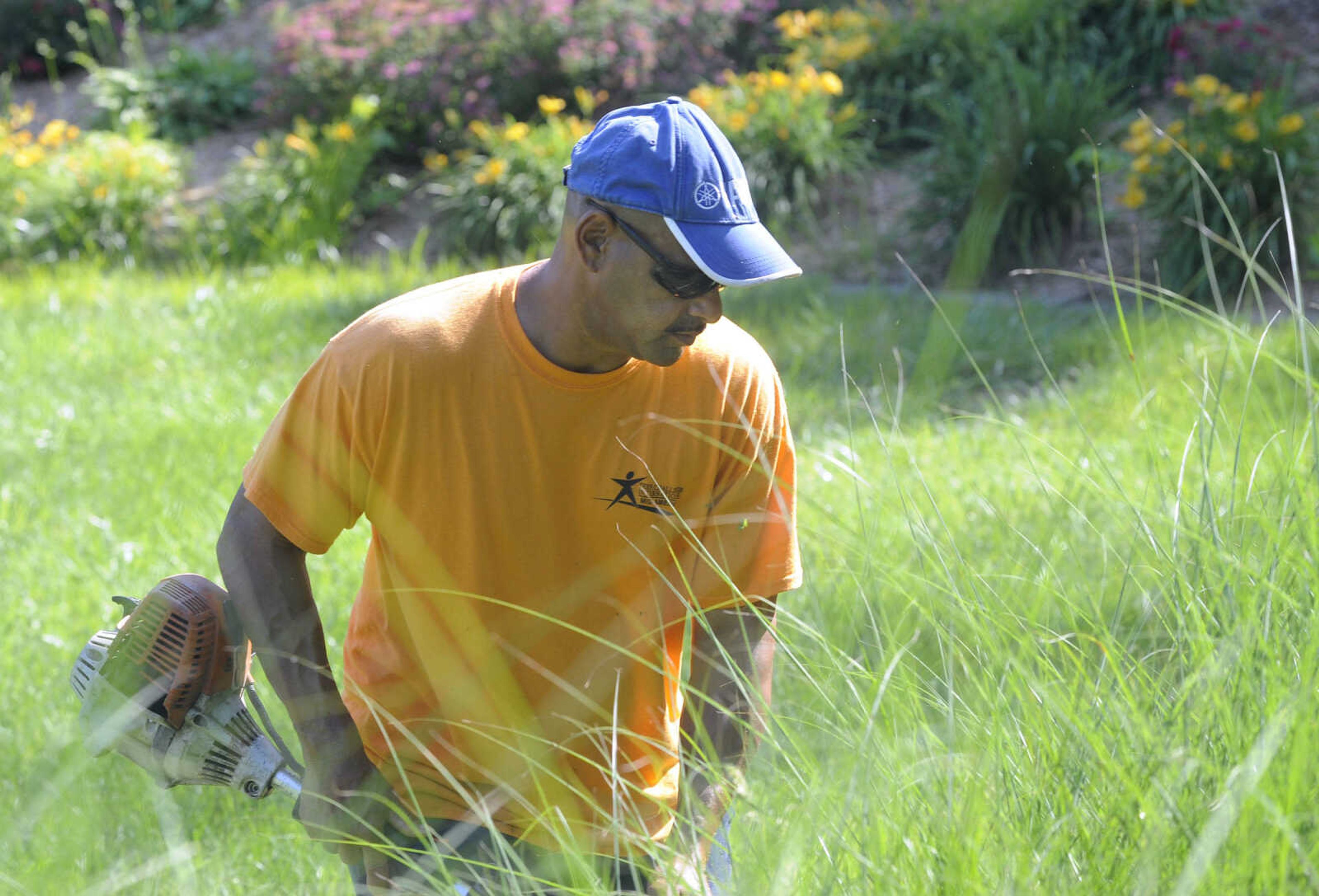 FRED LYNCH ~ flynch@semissourian.com
Derek Ramos, a student at Adult and Teen Challenge Mid-America, trims a lawn Saturday, June 3, 2017 in Cape Girardeau.