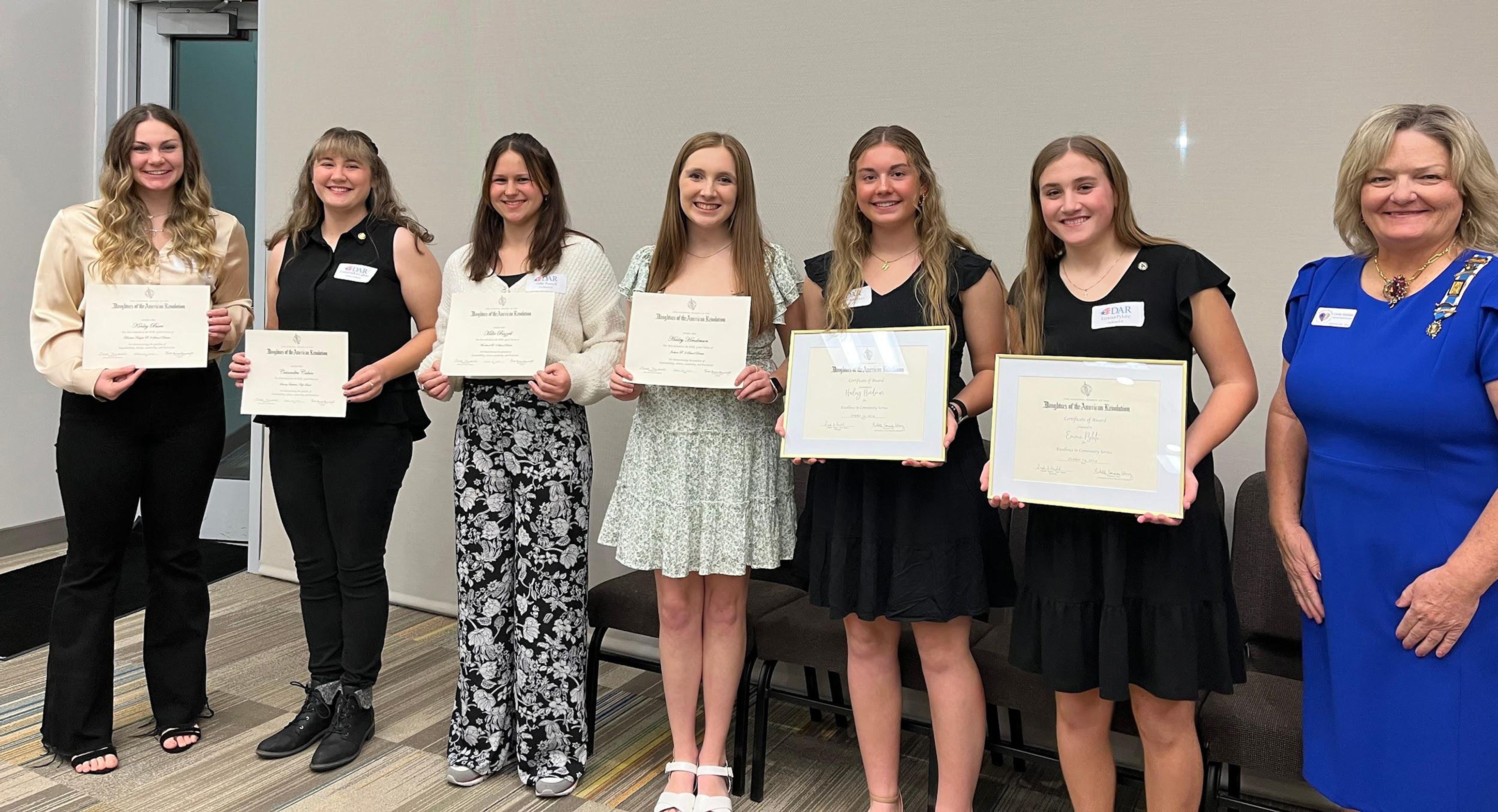 2024 DAR Good Citizens Award winners Kinley Burr, Cassondra Calvin, Millie Bazzell and Hailey Henderson; and Community Service Award winners Hailey Hindman and Emma Pylate with John Guild Chapter Regent Linda Venable.