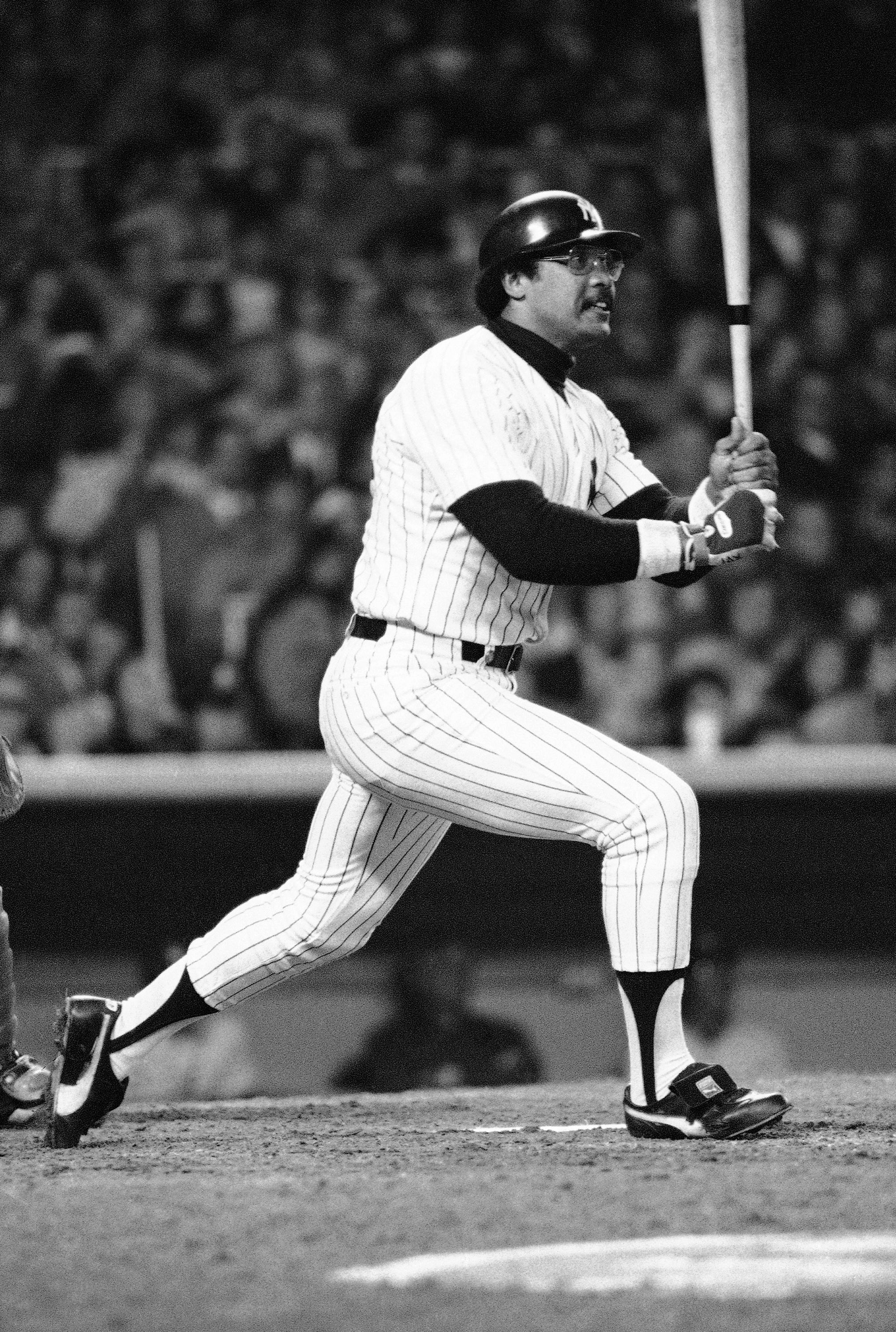 Yankees' Reggie Jackson watches the path of the ball on a swing as he knocks second homer in fifth inning of World Series game in New York, Oct. 18, 1977. Yanks beat Dodgers, 8-4, to win world championship. 