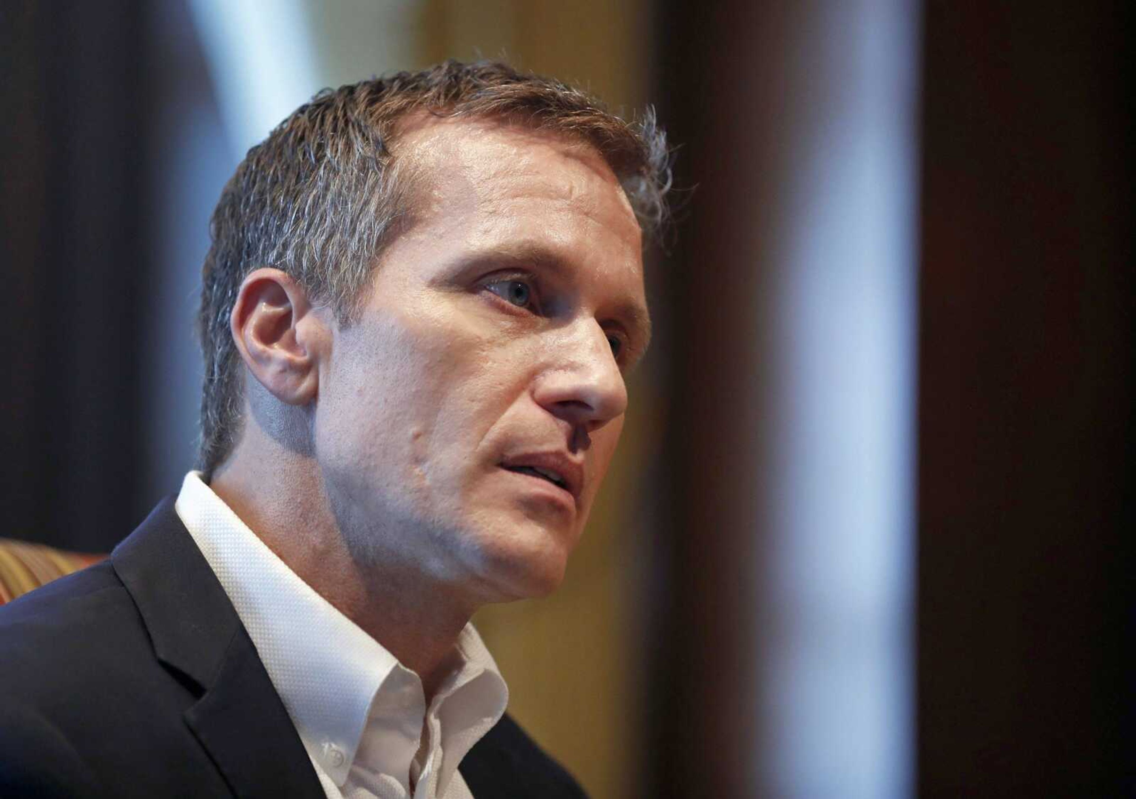 FILE - In this Jan. 20, 2018, file photo, Missouri Gov. Eric Greitens listens to a question during an interview in his office at the Capitol in Jefferson City, Mo., where discussed having an extramarital affair before taking office. Jury selection is set to begin Thursday, May 10, 2018, in Greitens  felony invasion of privacy trial. He is accused of taking an unauthorized photo of a woman while she was partially nude during a 2015 sexual encounter, before he was elected. (AP Photo/Jeff Roberson, File)