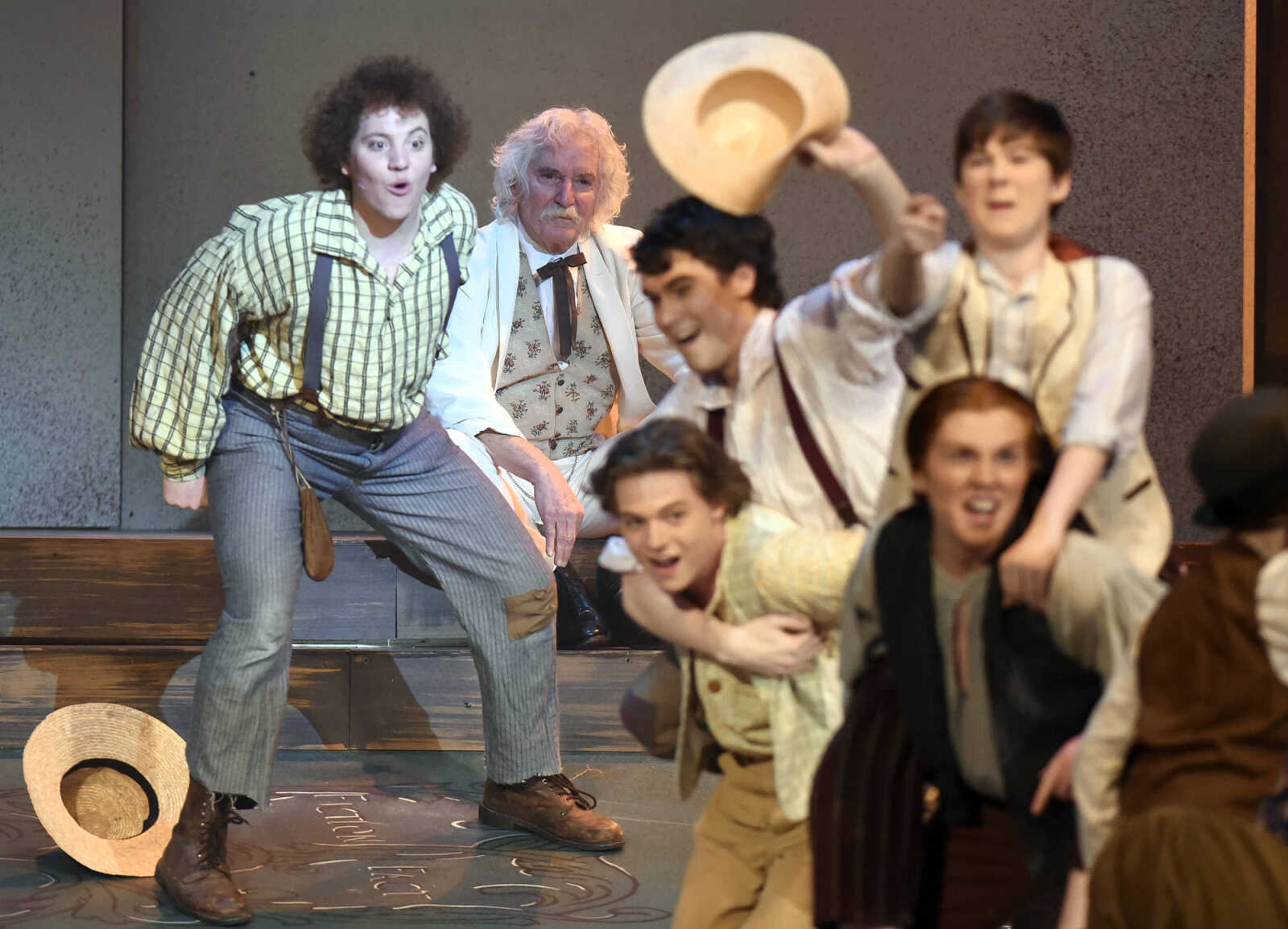 Mark Twain, portrayed by Lester Goodin, watches from the background as Huckleberry Finn, played by Nicholas Kuchem, and the cast perform during The Conservatory of Theatre and Dance's production of "Big River: The Adventures of Huckleberry Finn" on Wednesday, Feb. 22, 2017, at Southeast Missouri State University's River Campus. The show runs through Sunday.