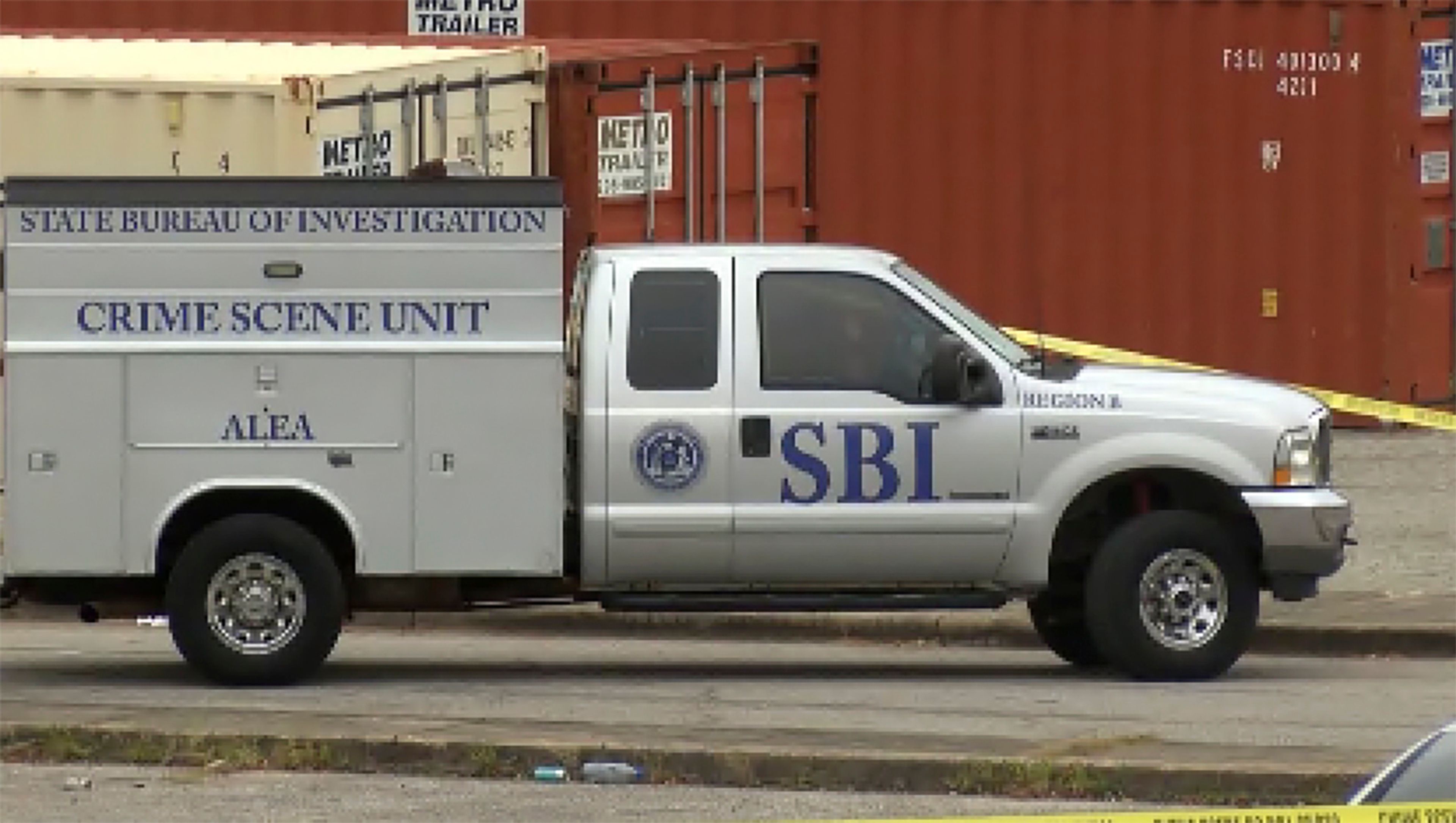 This image taken from video provided by WSFA shows law enforcement working at the scene of a shooting at Tuskegee University, Sunday, Nov. 10, 2024, in Tuskegee, Ala. (WSFA via AP)