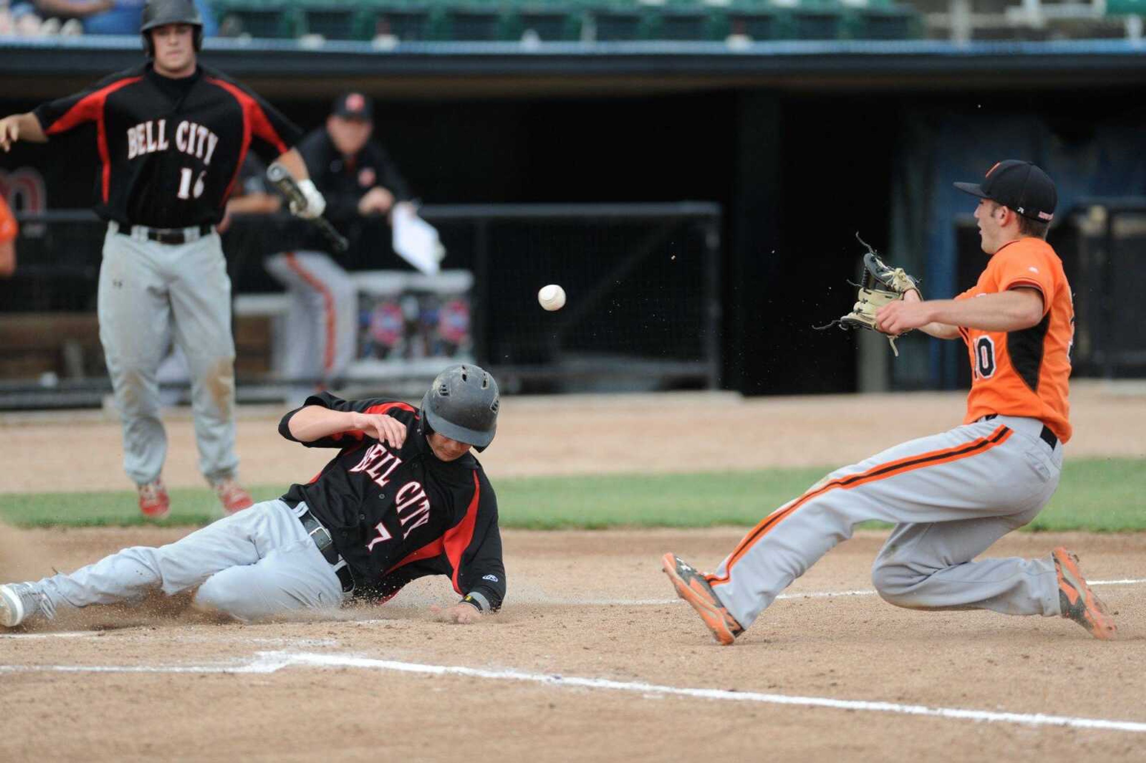 Bell City's Nate Finney slides safely home past Northwest's Trey Green in the fourth inning during a Class 1 semifinal, Tuesday, June 2, 2015 in O Fallon, Missouri. (Glenn Landberg)