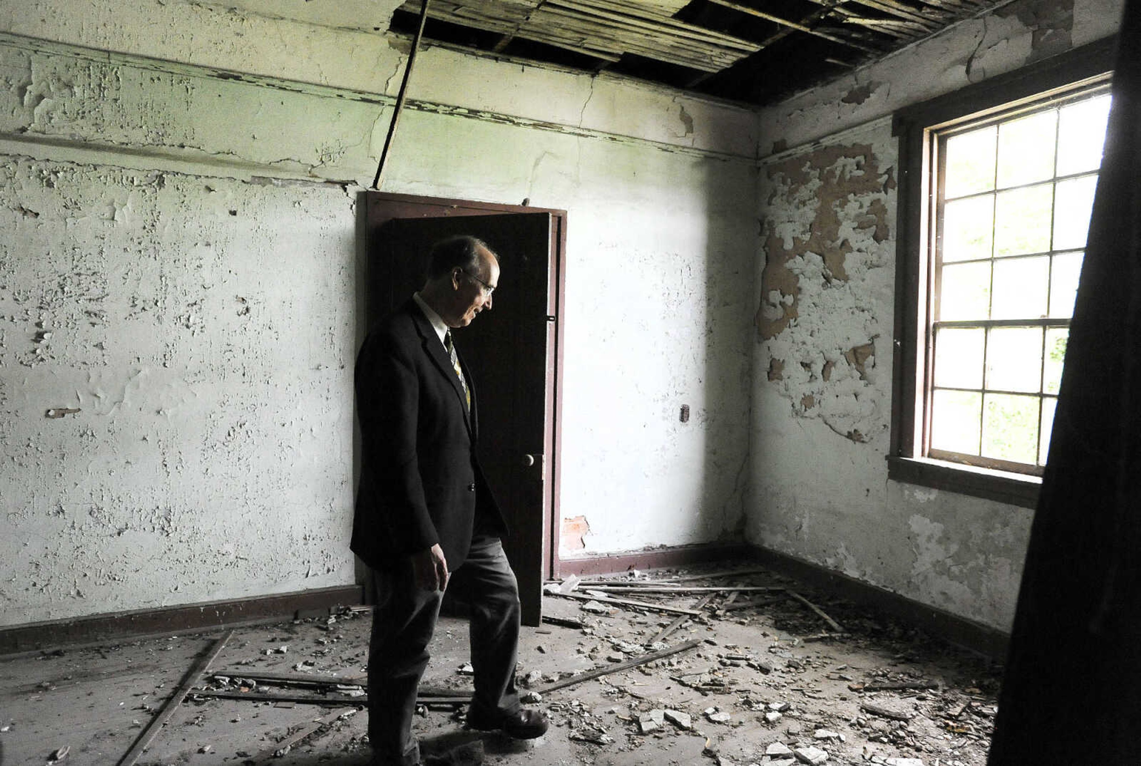 LAURA SIMON ~ lsimon@semissourian.com

Steven Hoffman, coordinator of Southeast Missouri State University's  historic preservation program, stands in a central room of the historic Reynolds House Monday afternoon, May 2, 2016. The Cape Girardeau house, which stands at 623 N. Main Street, was built in 1857.