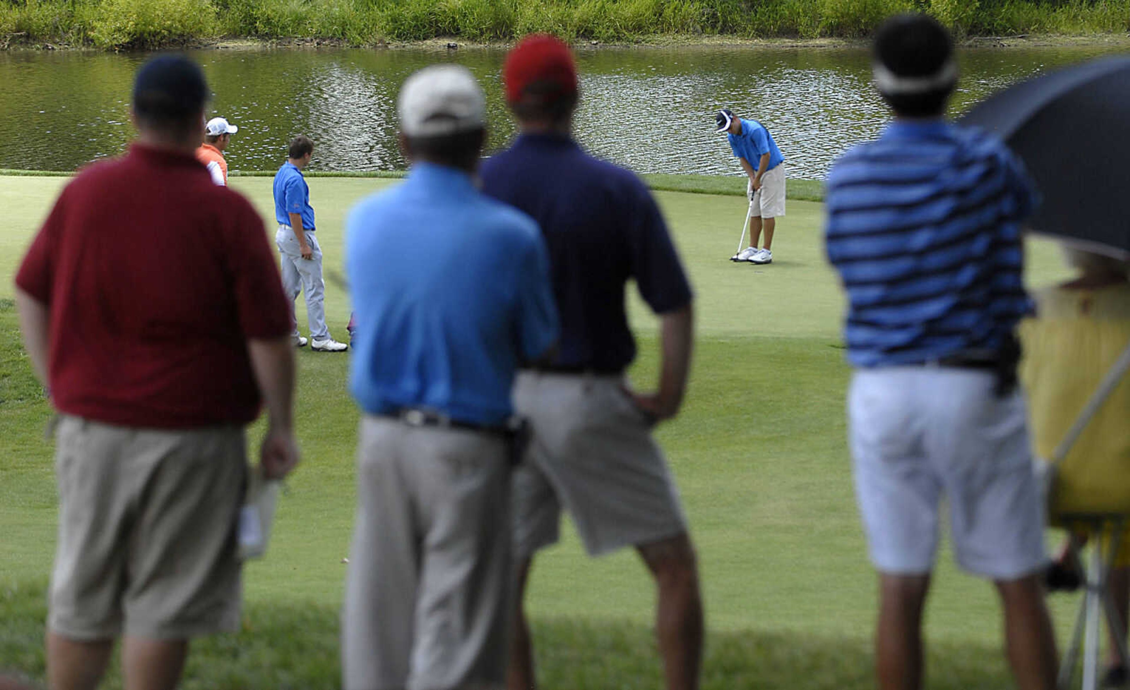 KIT DOYLE ~ kdoyle@semissourian.com
Spectators watch Johnathan Schnitzer putt on the 14th hole Friday, July 3, 2009, in the AJGA Rolex Tournament of Champions at Dalhousie Golf Club.