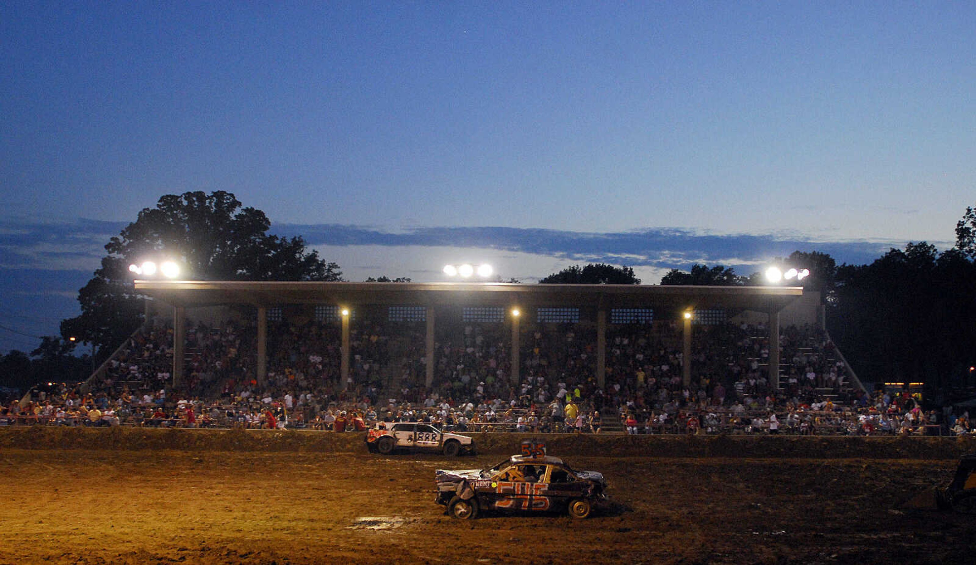 LAURA SIMON~lsimon@semissourian.com
The sun sets behind the Dual Demolition Derby during the U.S.A. Veterans Fourth of July celebration at Arena Park in Cape Girardeau Sunday, July 4, 2010.