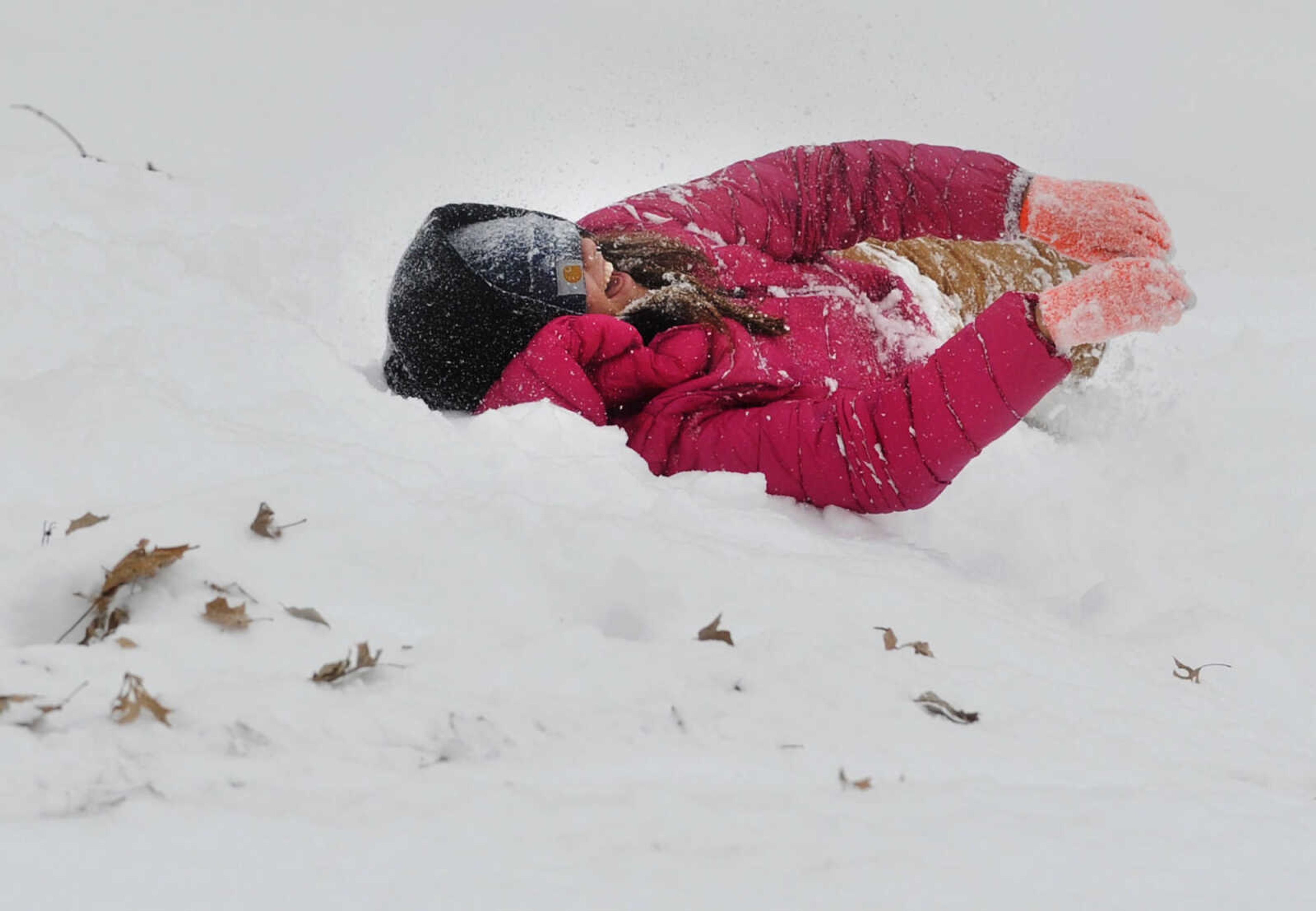 LAURA SIMON ~ lsimon@semissourian.com

Kat Wallhausen lays in the snow after sledding down the hill outside the Common Pleas Courthouse, Monday, Feb. 16, 2015, in Cape Girardeau.