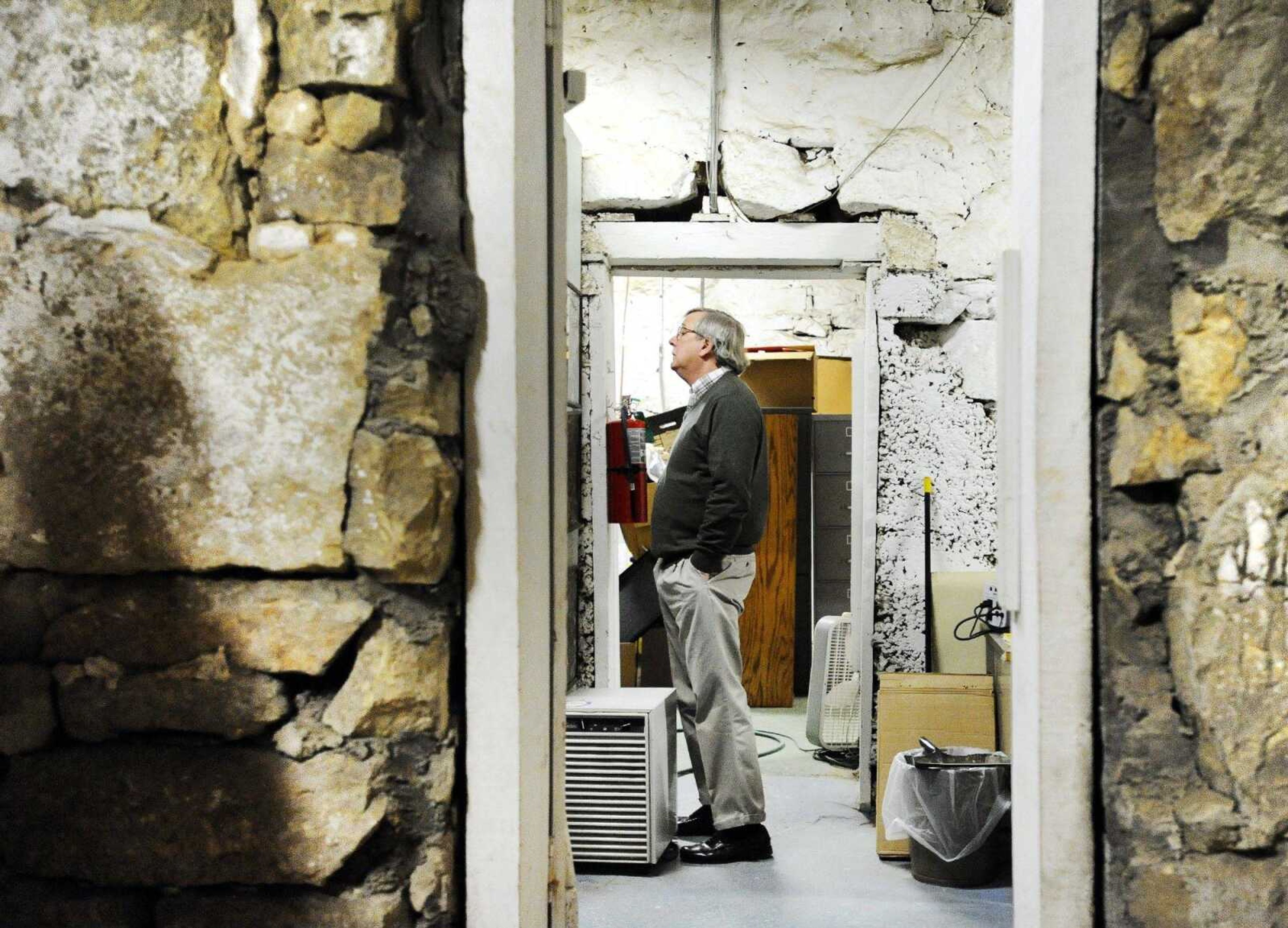 Judge Benjamin Lewis looks through the middle chamber of the Common Pleas Courthouse basement Wednesday in Cape Girardeau. (Laura Simon)